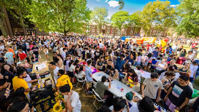Crowd of people on campus at Flock Party Student Involvement Fair