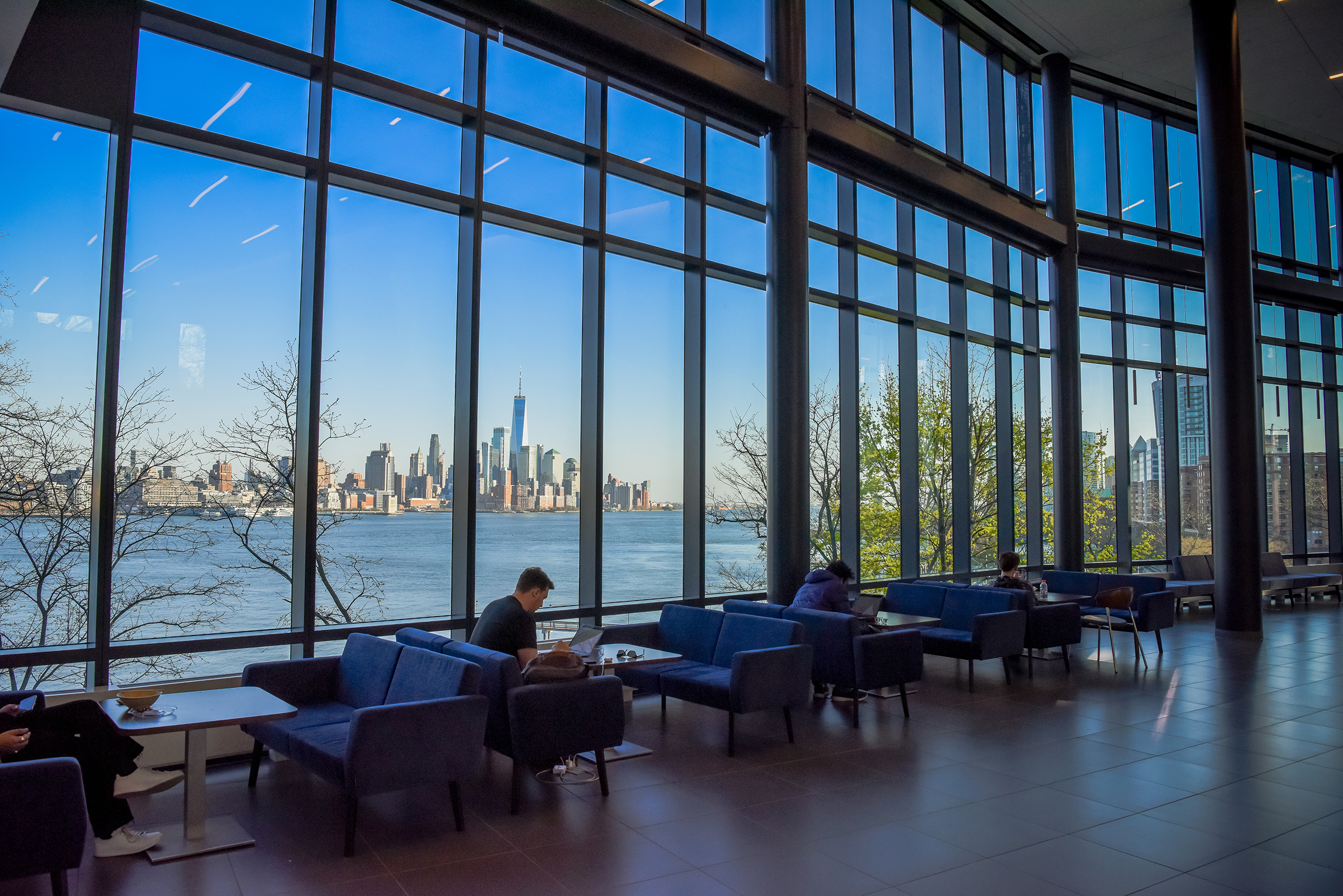 Student studying in UCC with NYC skyline in the background