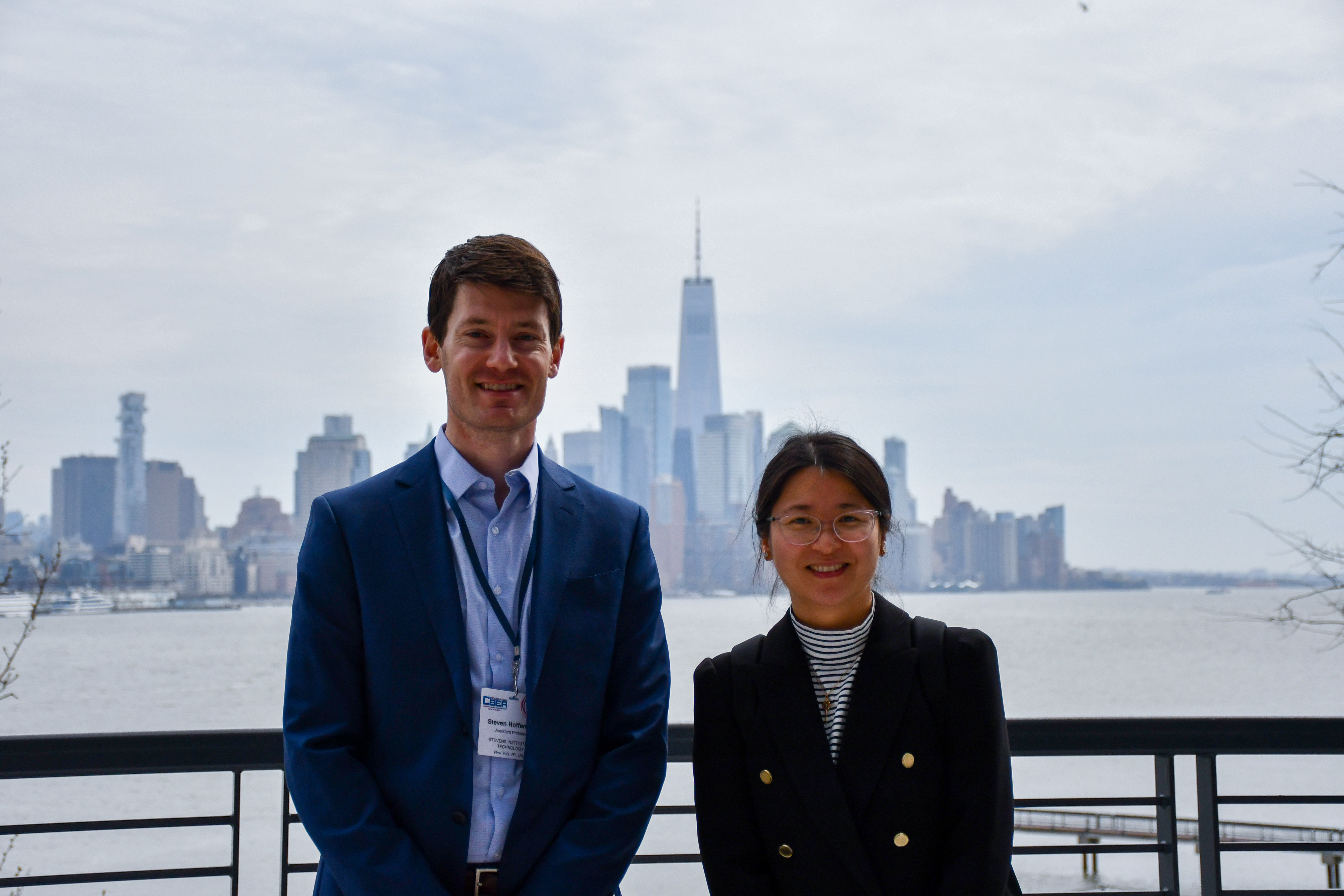 Stevens professors Steven Hoffenson and Lu Xiao with New York City in the background