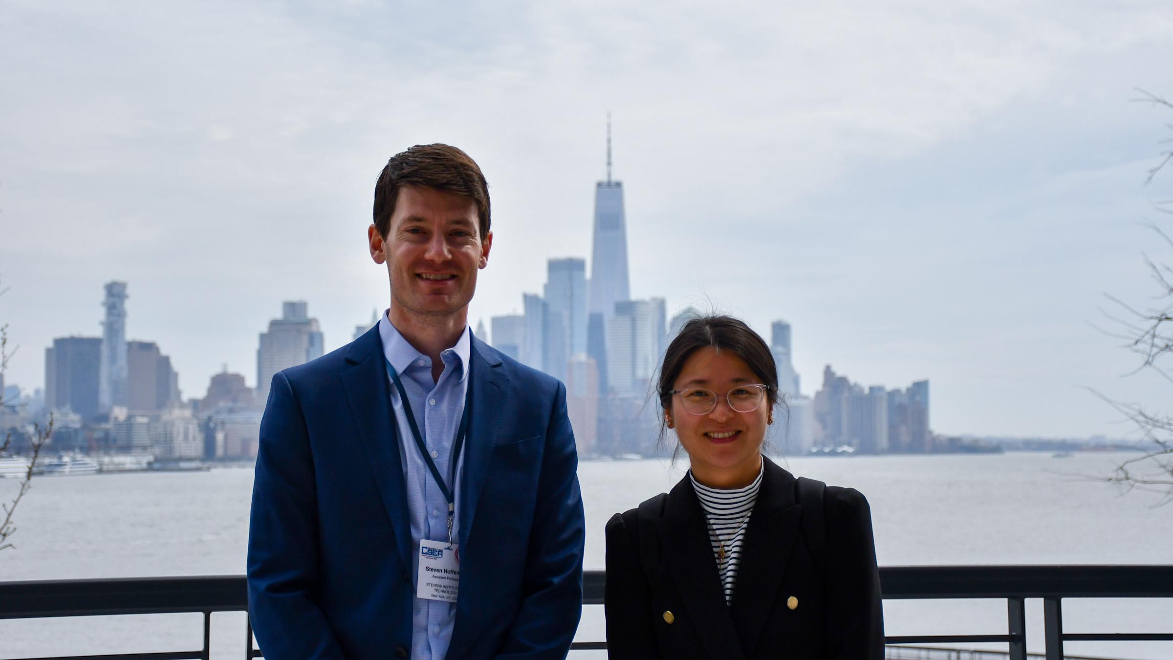 Stevens professors Steven Hoffenson and Lu Xiao with New York City in the background