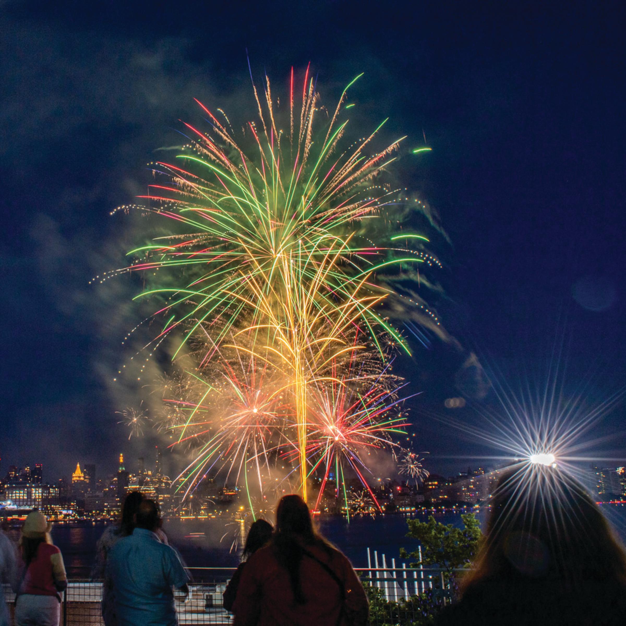 Crowd watches fireworks over the Hudson River