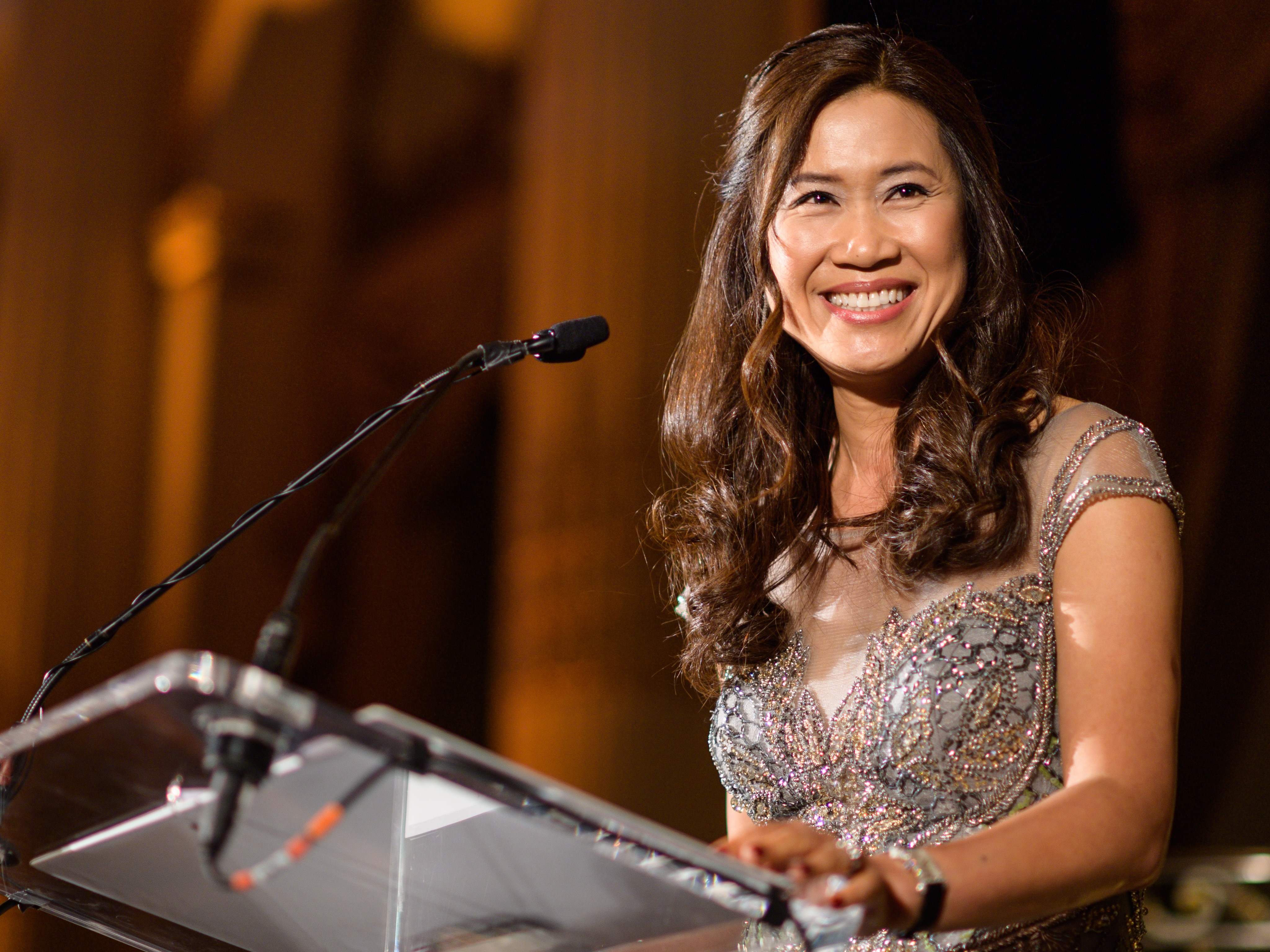 Woman speaks at podium at the Stevens Awards Gala