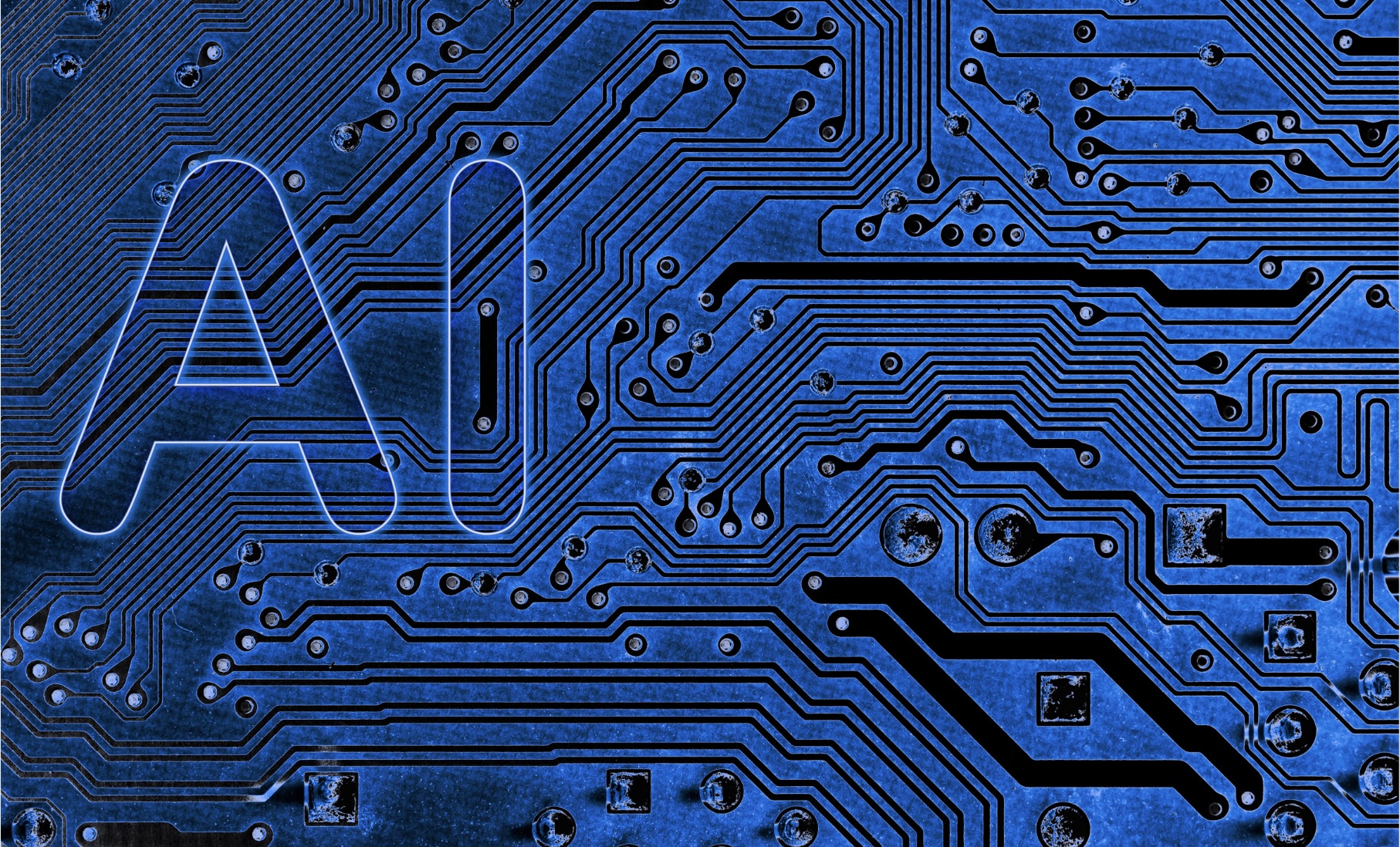 An abstract close up of a mainboard electronic computer background with AI written on the left side. 