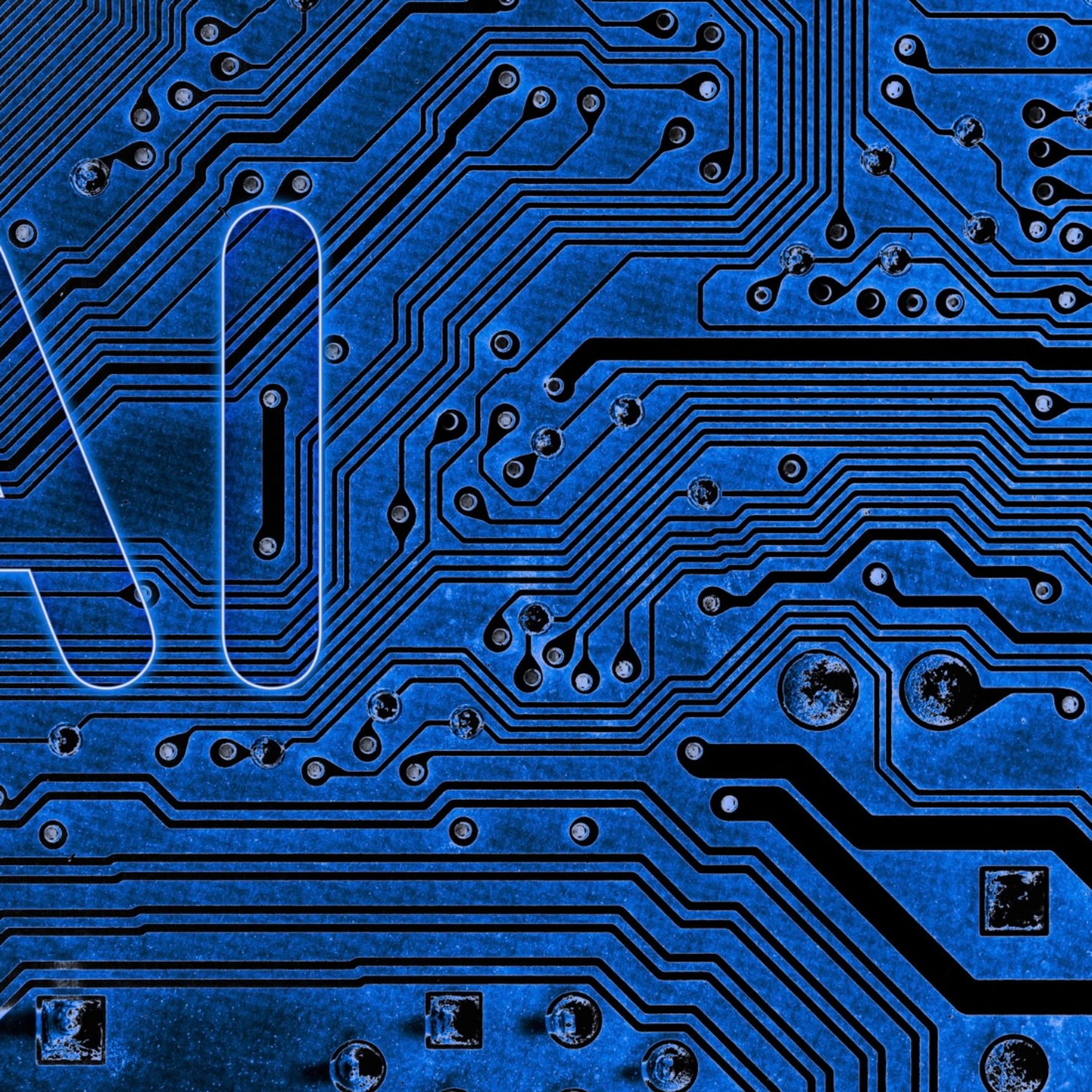 An abstract close up of a mainboard electronic computer background with AI written on the left side.