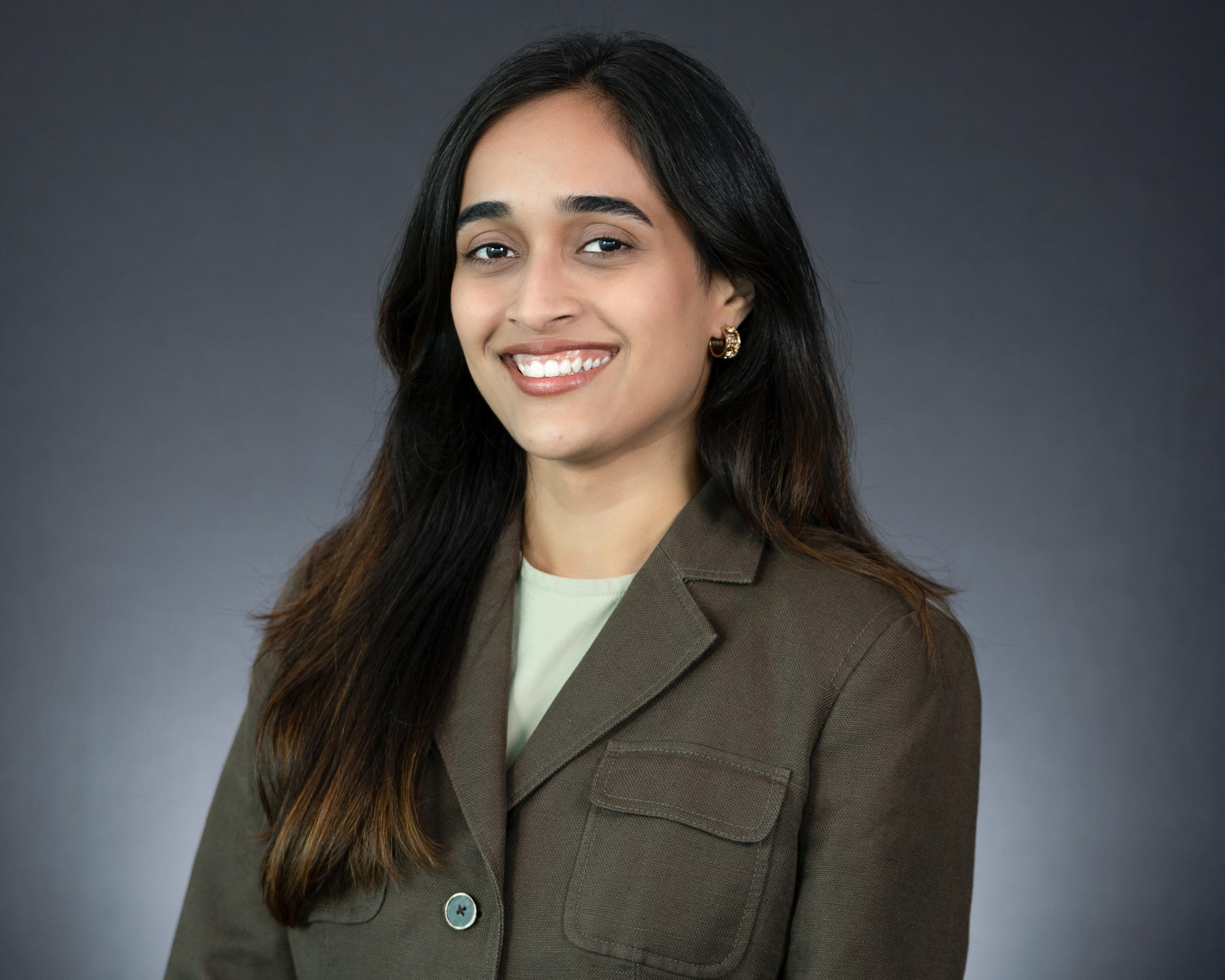 Headshot of Sweenal Godrick Pereira wearing professional attire. 