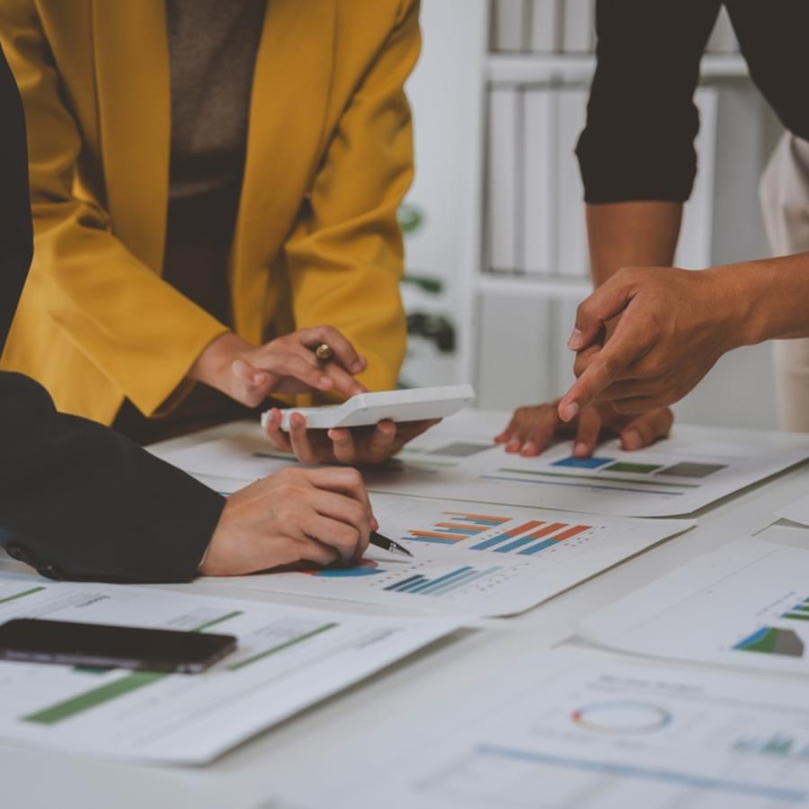 A team of project managers have a small team meeting.