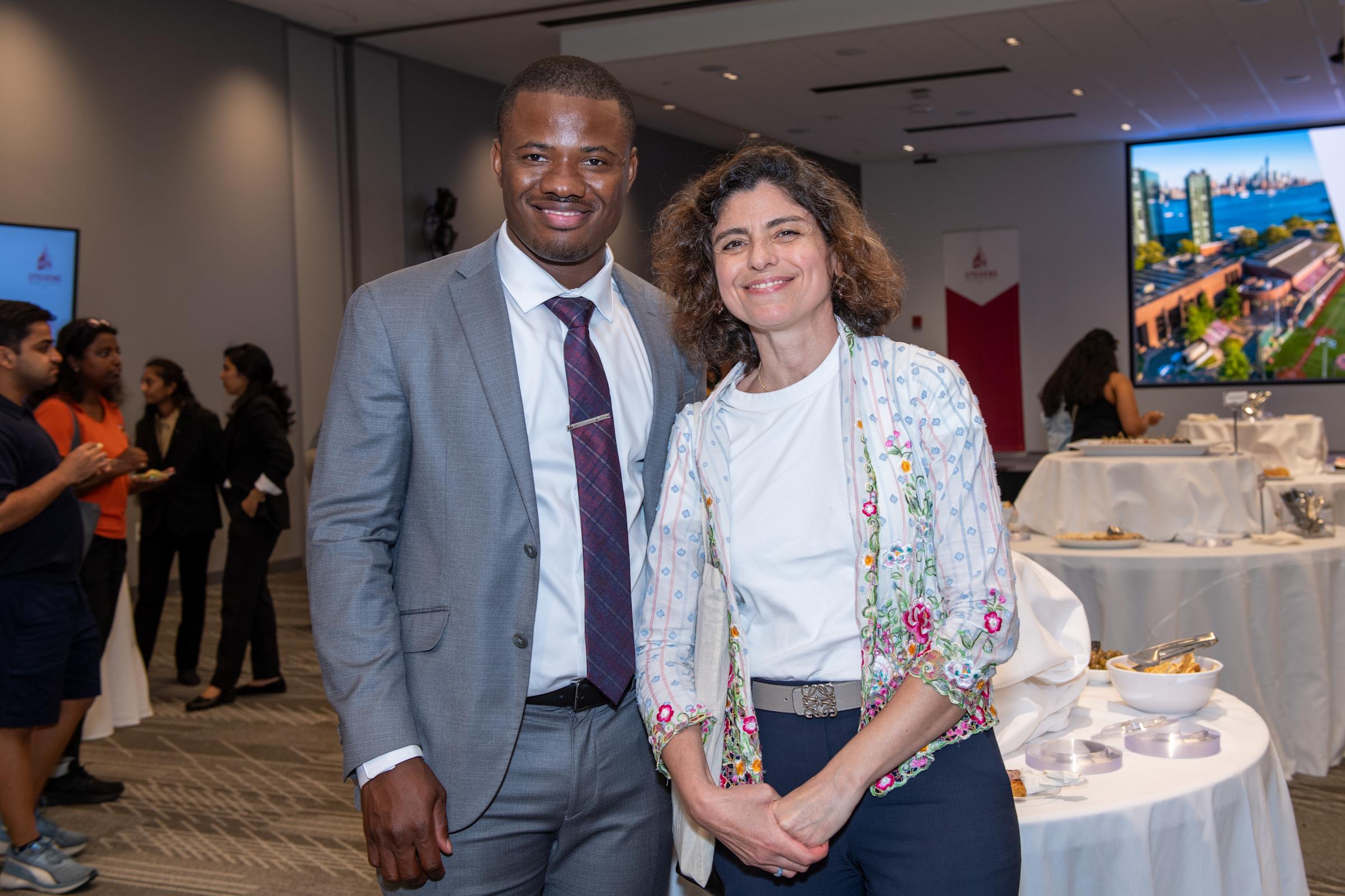 A photograph of Christopher Mbonu on the left and Pinar Akcora on the right.