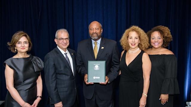 Alumni stand with President Nariman Farvardin