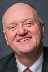 Headshot of Dr. Karolyi