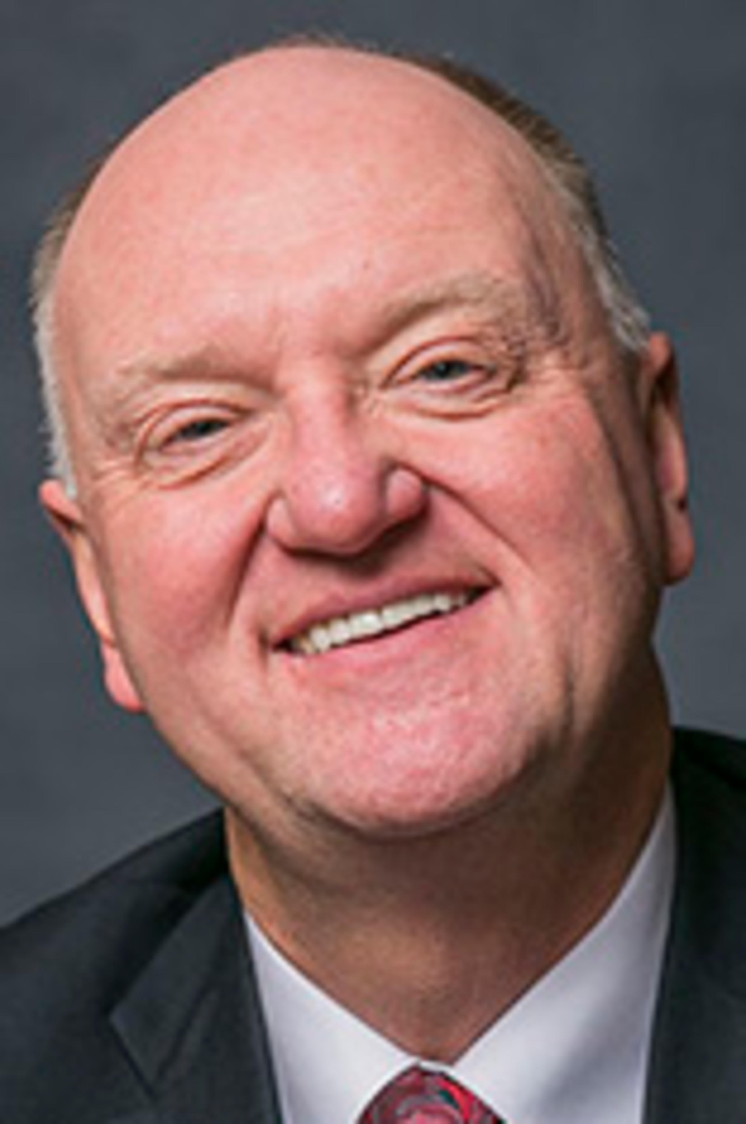 Headshot of Dr. Karolyi