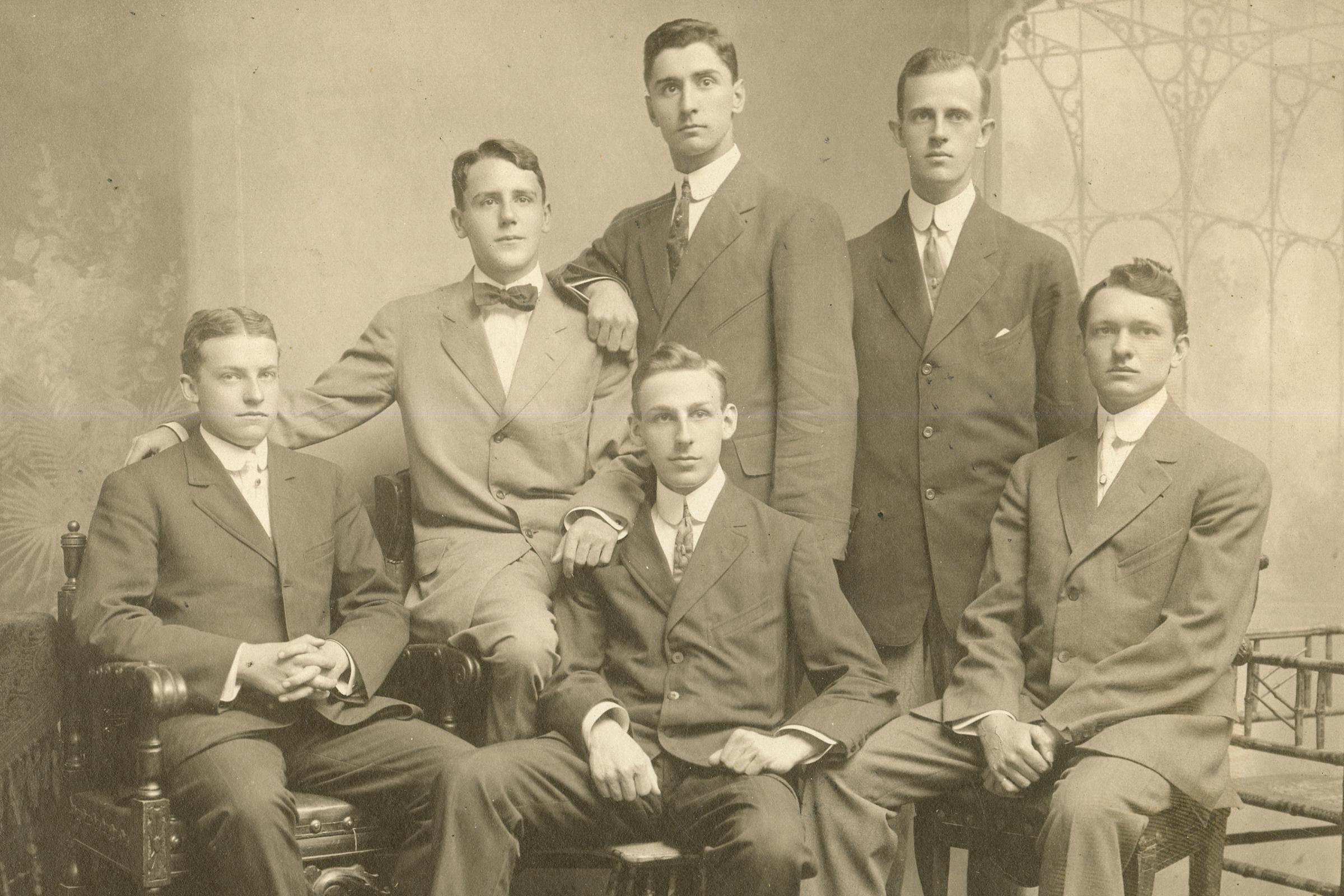 A group photo from 1909 of a group of students in suits.
