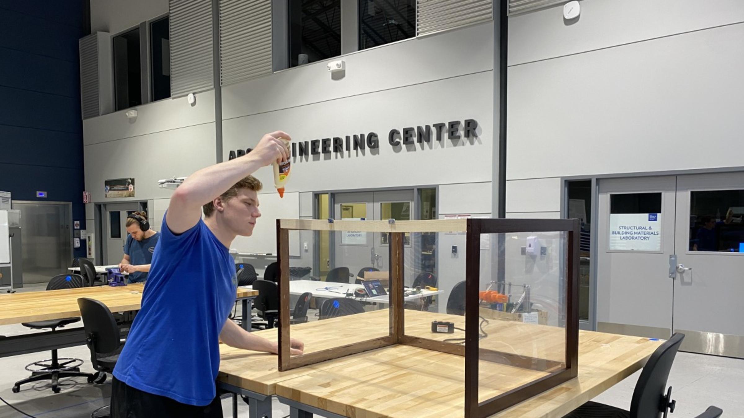 Student working on the greenhouse