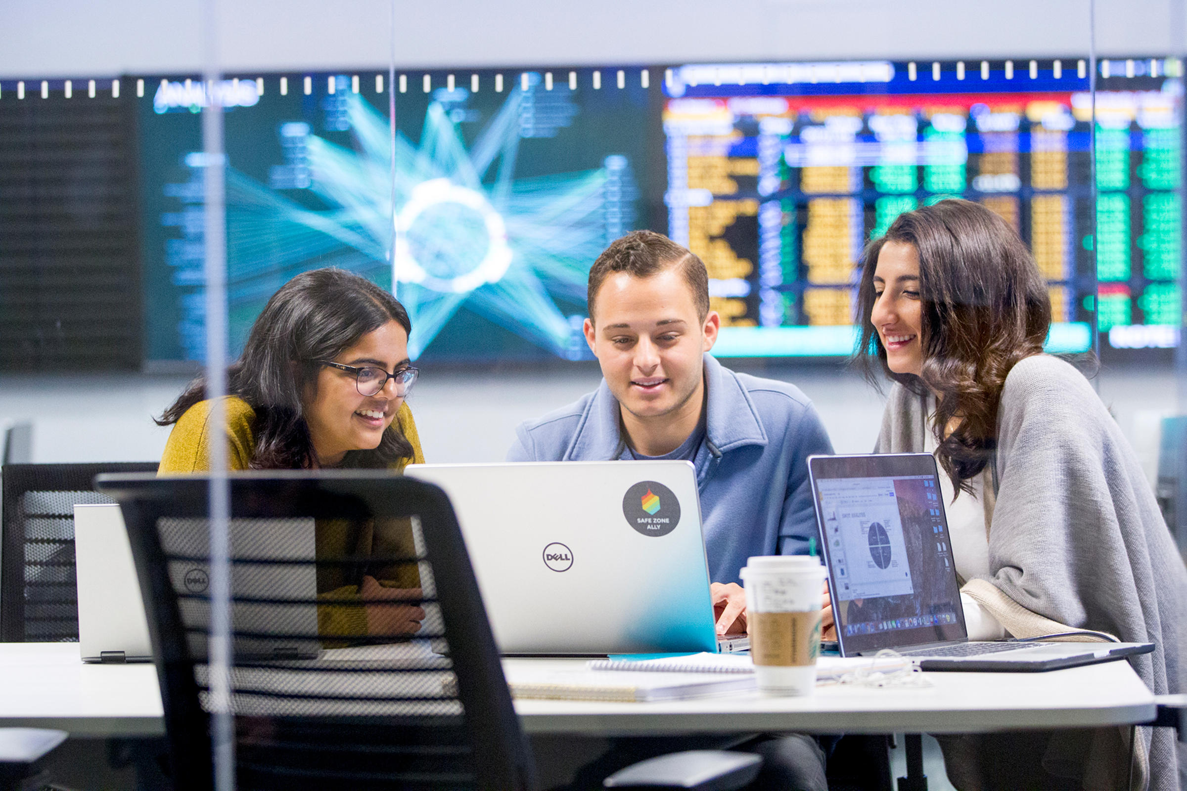 Three students inside the Hanlon lab at Stevens Institute of Technology