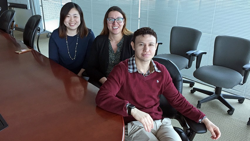 The three students who graduated with Ph.D.s in Business Administration in the spring of 2017.