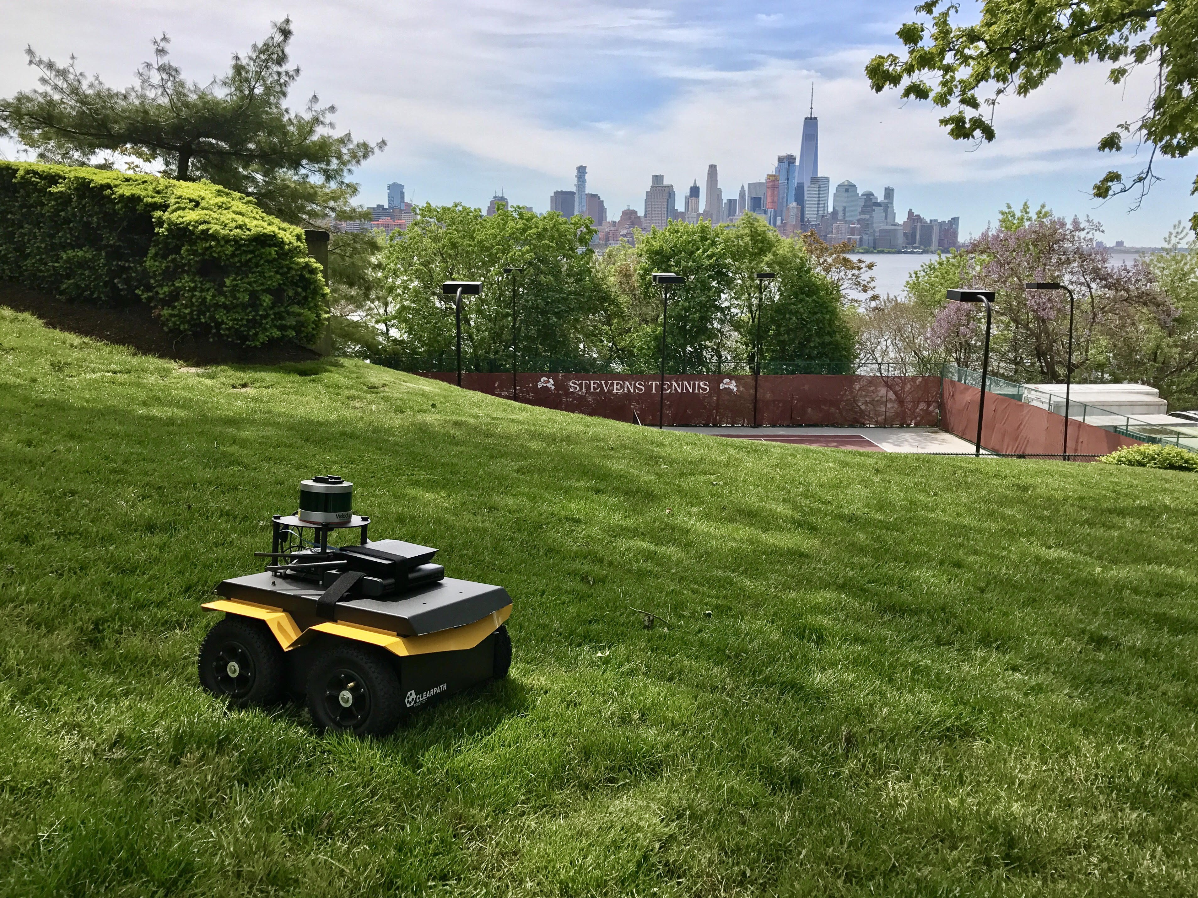 Stevens unmanned robot on top of a campus hill overlooking New York City