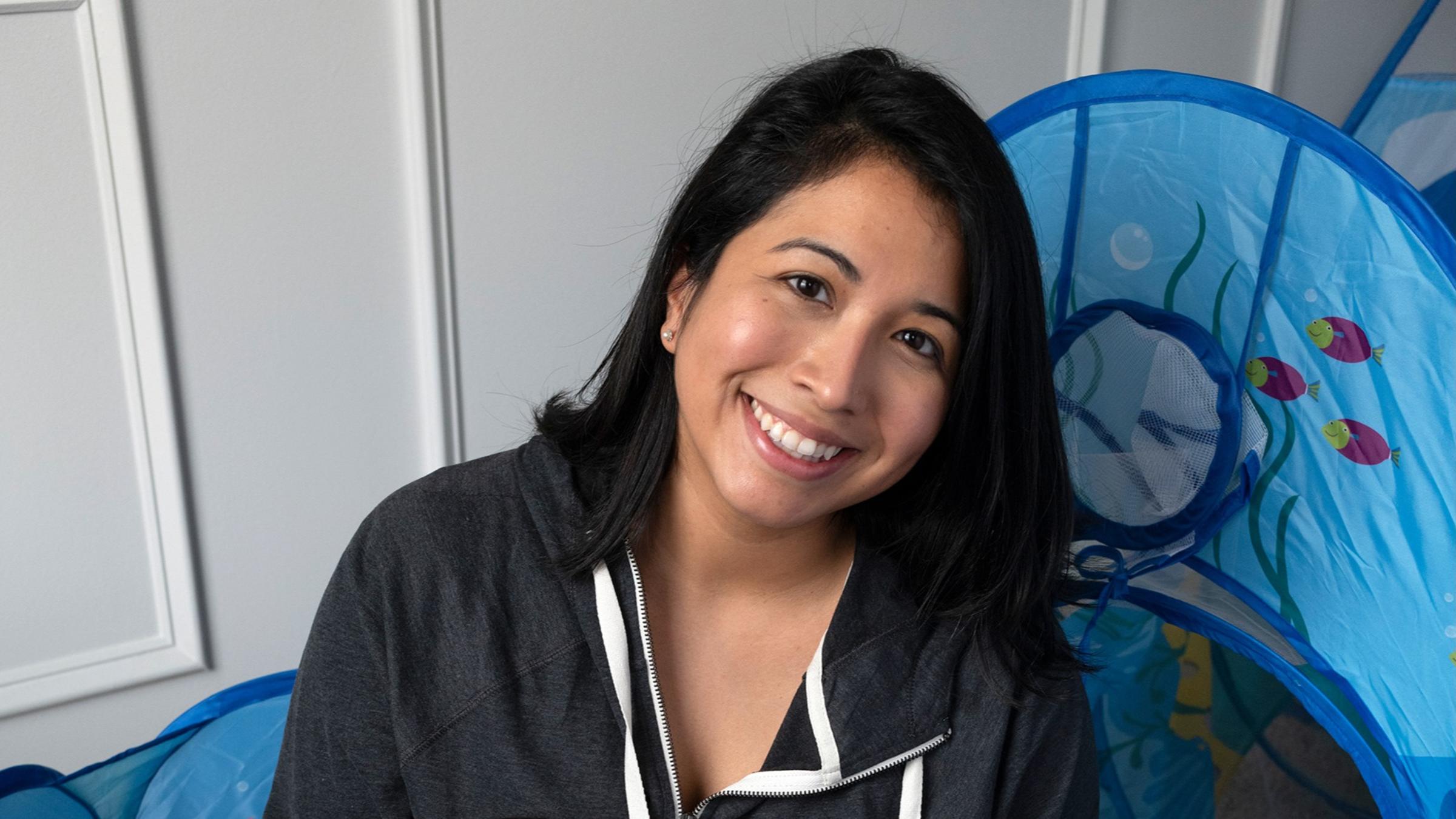 Portrait of Nathalie Ramos and her child.