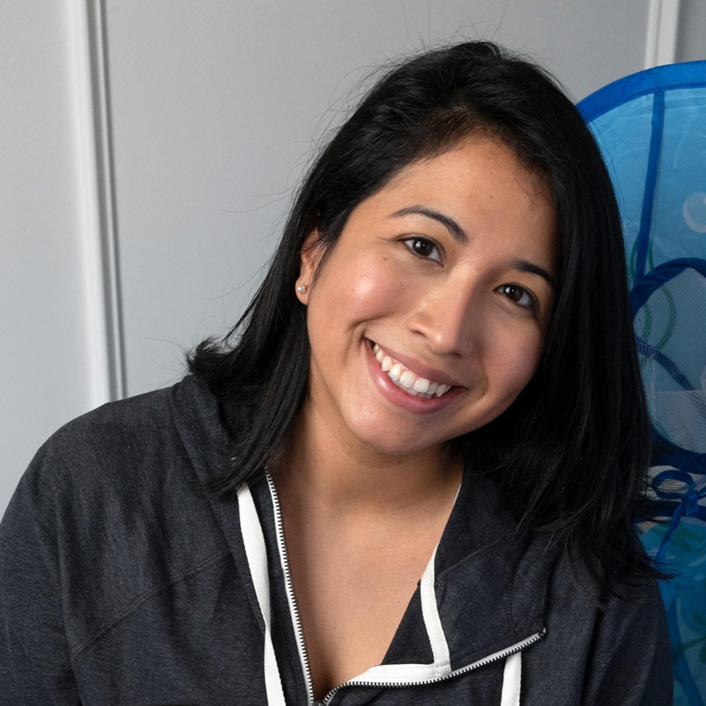 Portrait of Nathalie Ramos and her child.