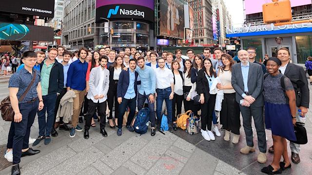 Students standing in Times Square during a visit to the offices of Nasdaq.