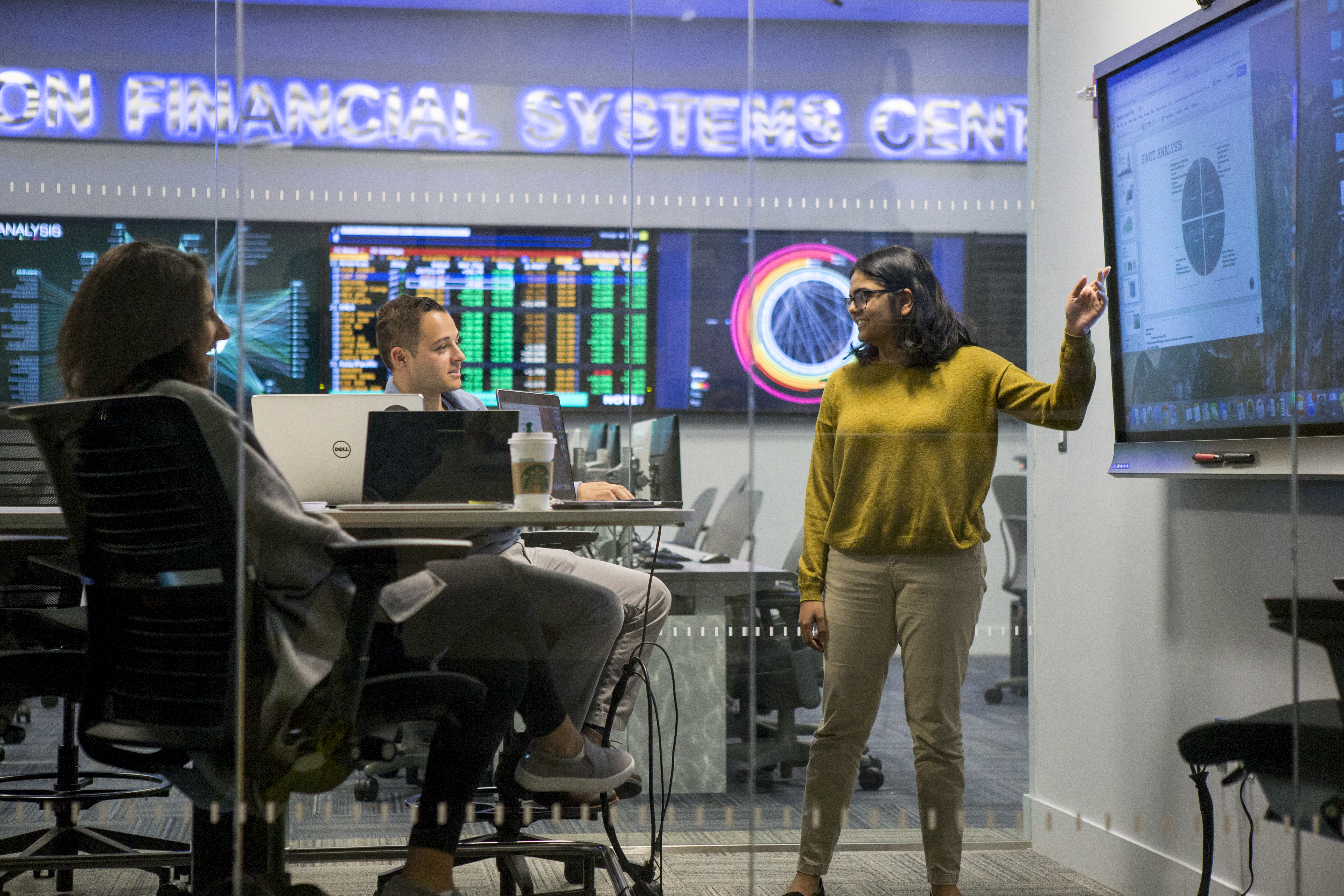 Students collaborating at Hanlon Financial Systems Center