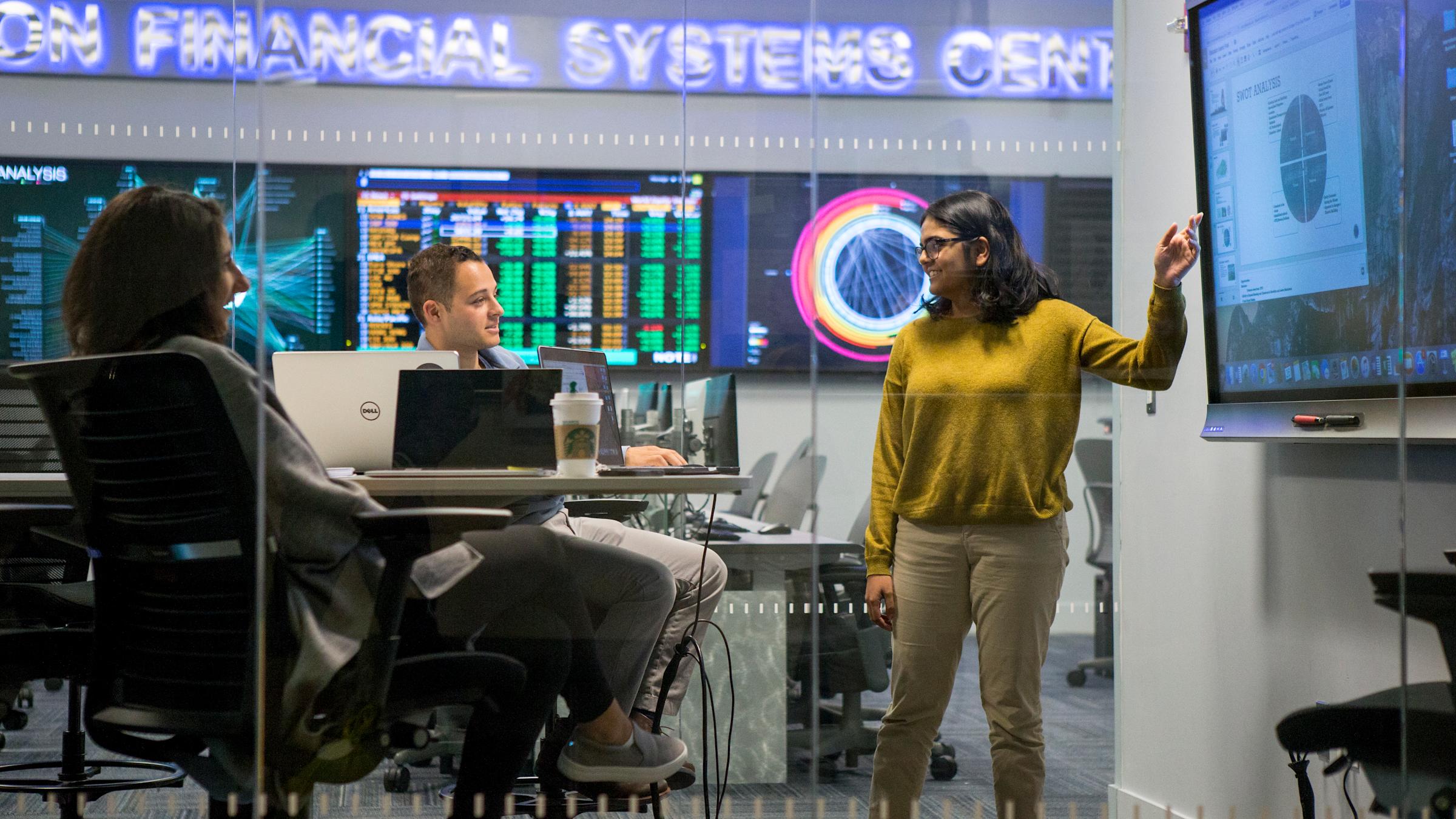 Students collaborating at Hanlon Financial Systems Center