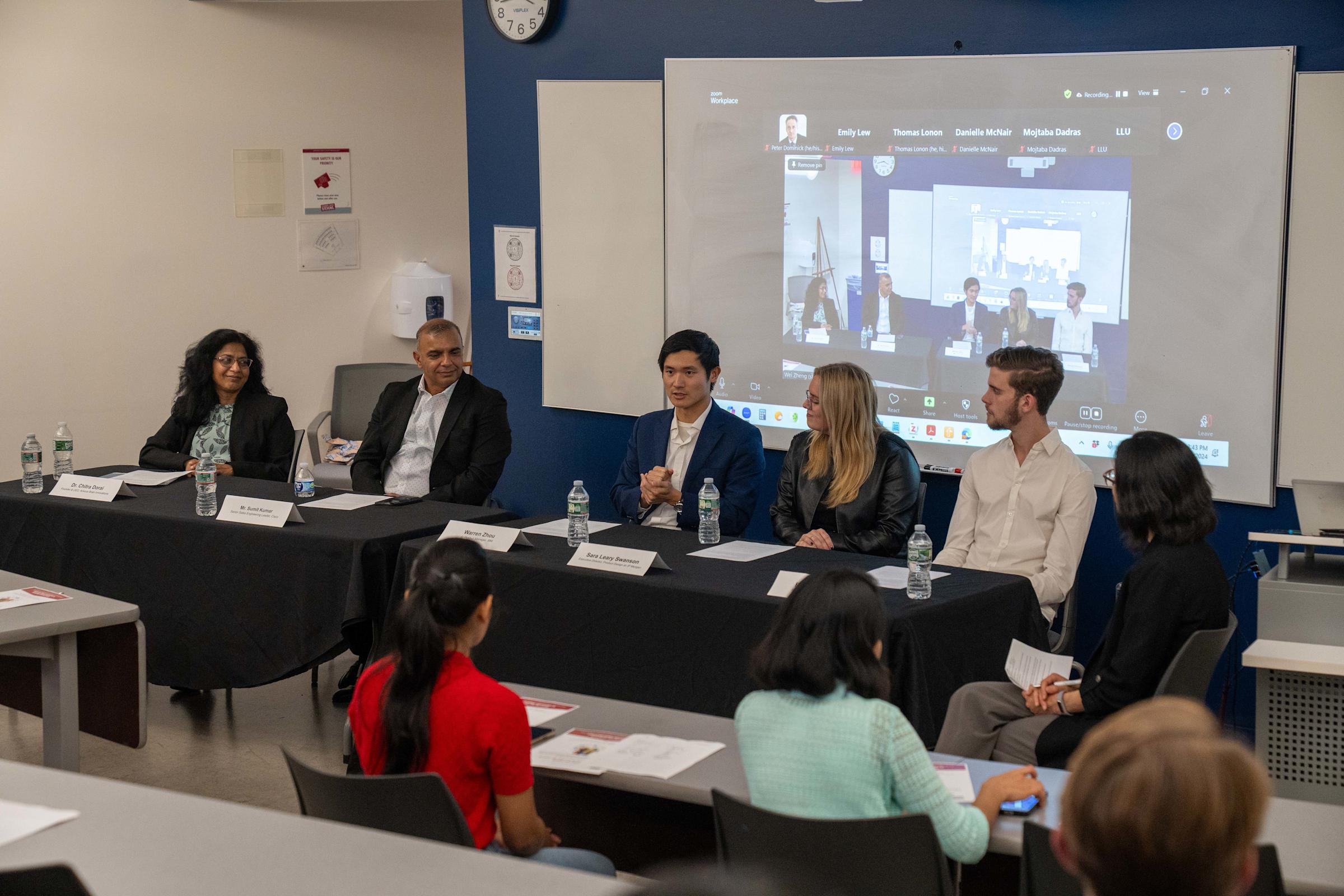 Panel of inclusive design experts speak with students in a classroom