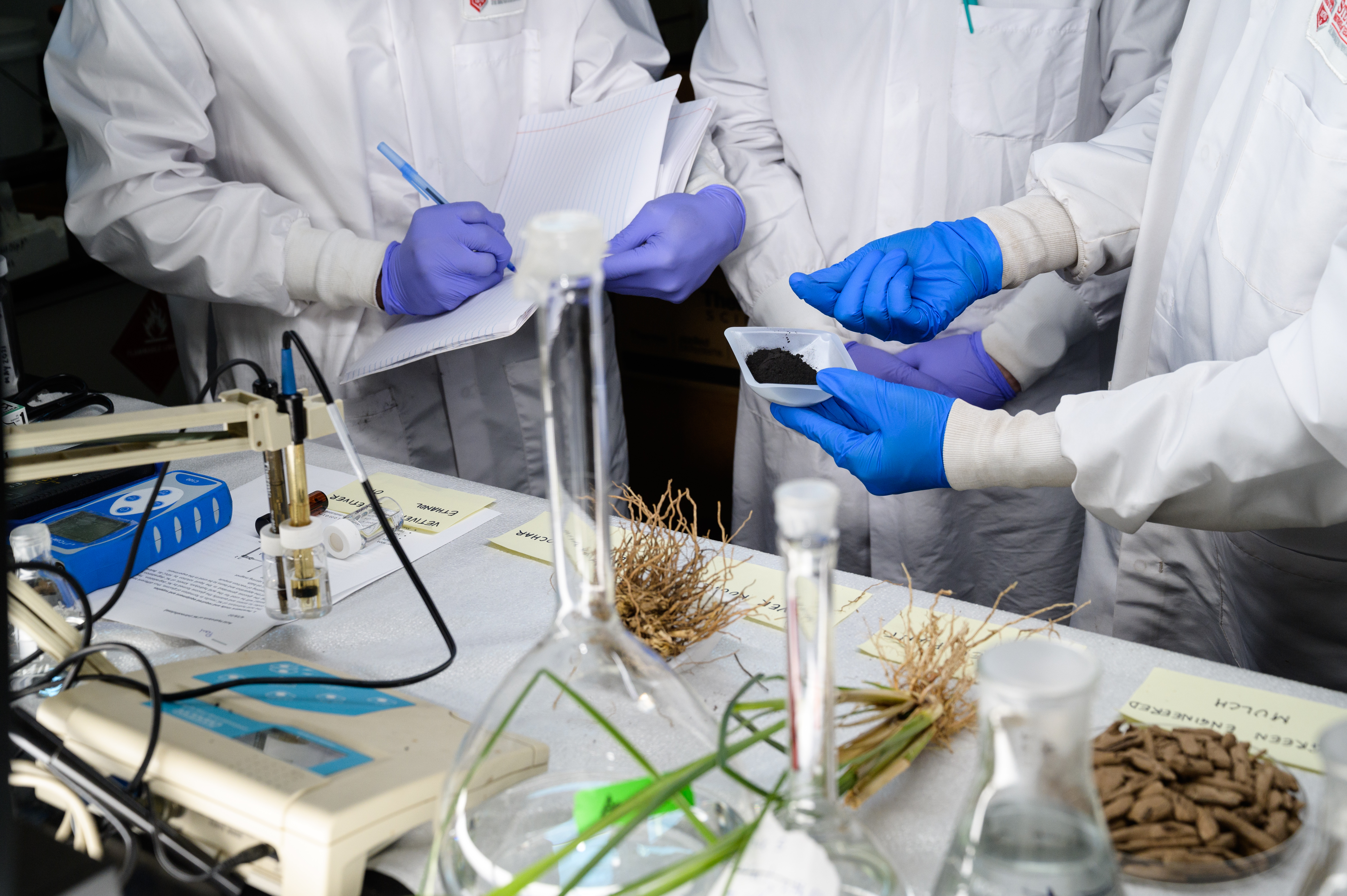students preparing to test materials in lab 