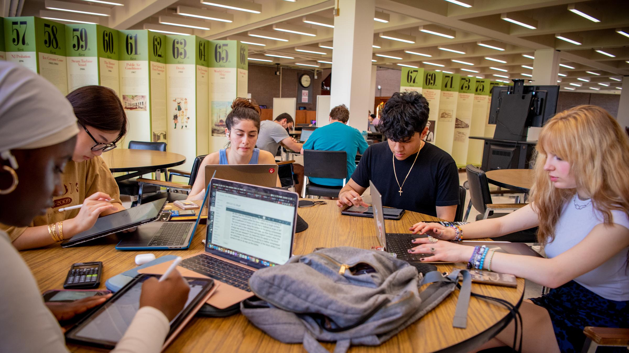 Students working at a round table.