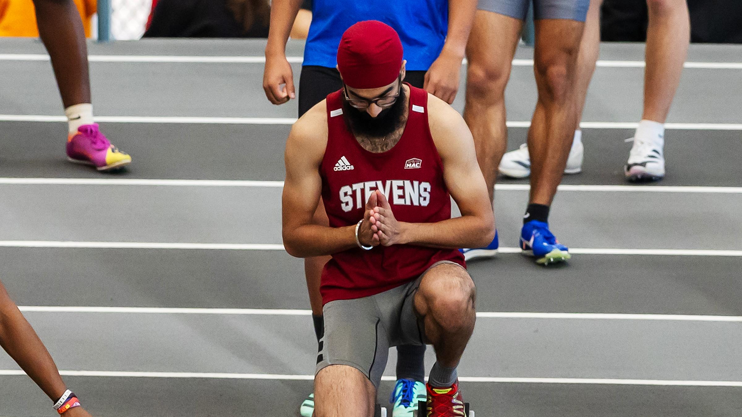 Rai Singh Bindra kneeling down moments before running in a track race