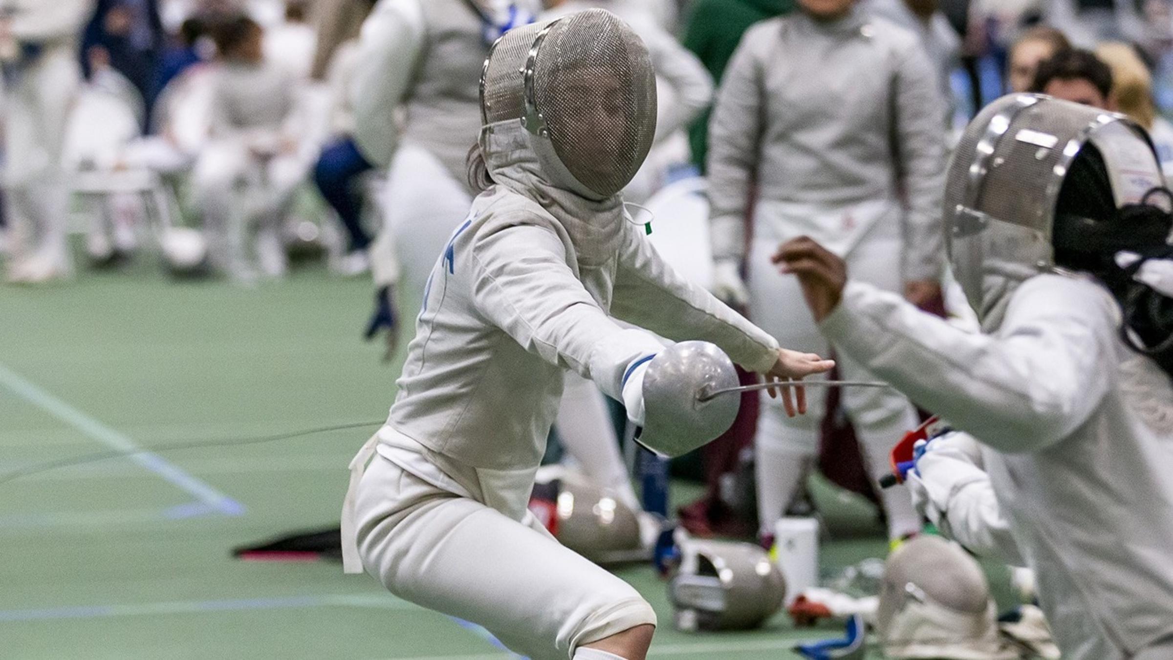 Arianna Daringa competes in a fencing bout.