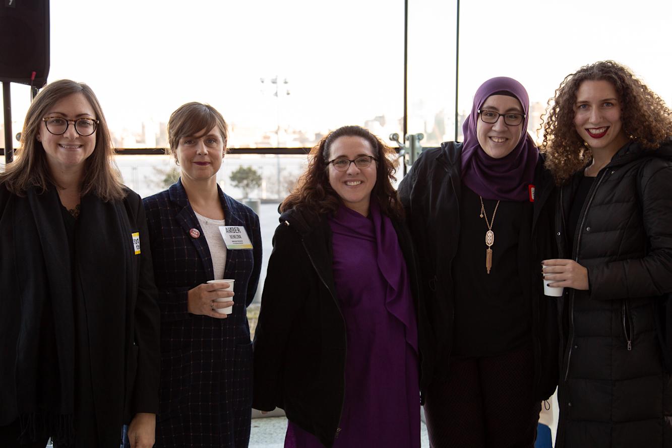 group of students and staff smiling at the conference