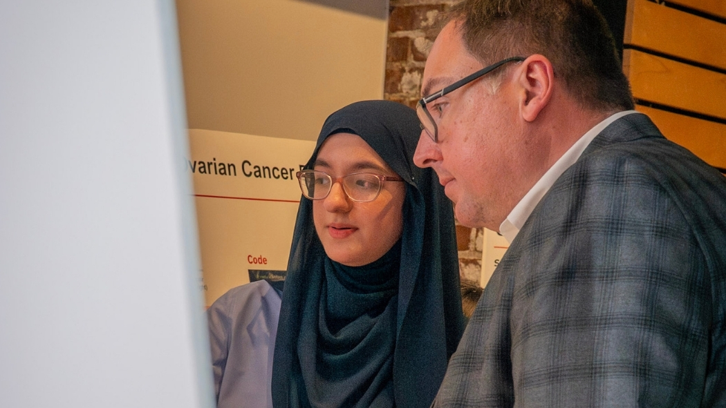 Student presenting poster.