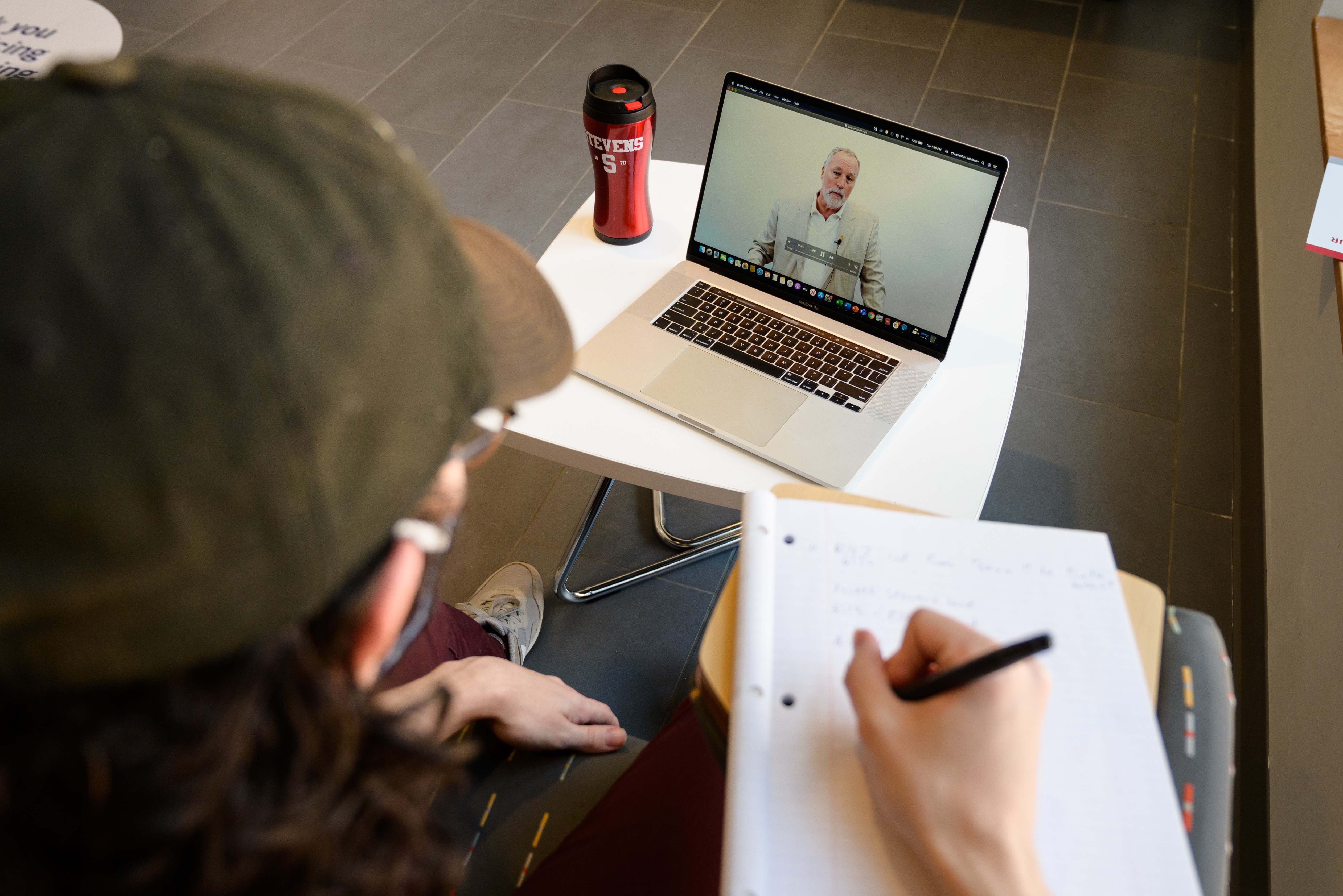 A student virtually attends a class.
