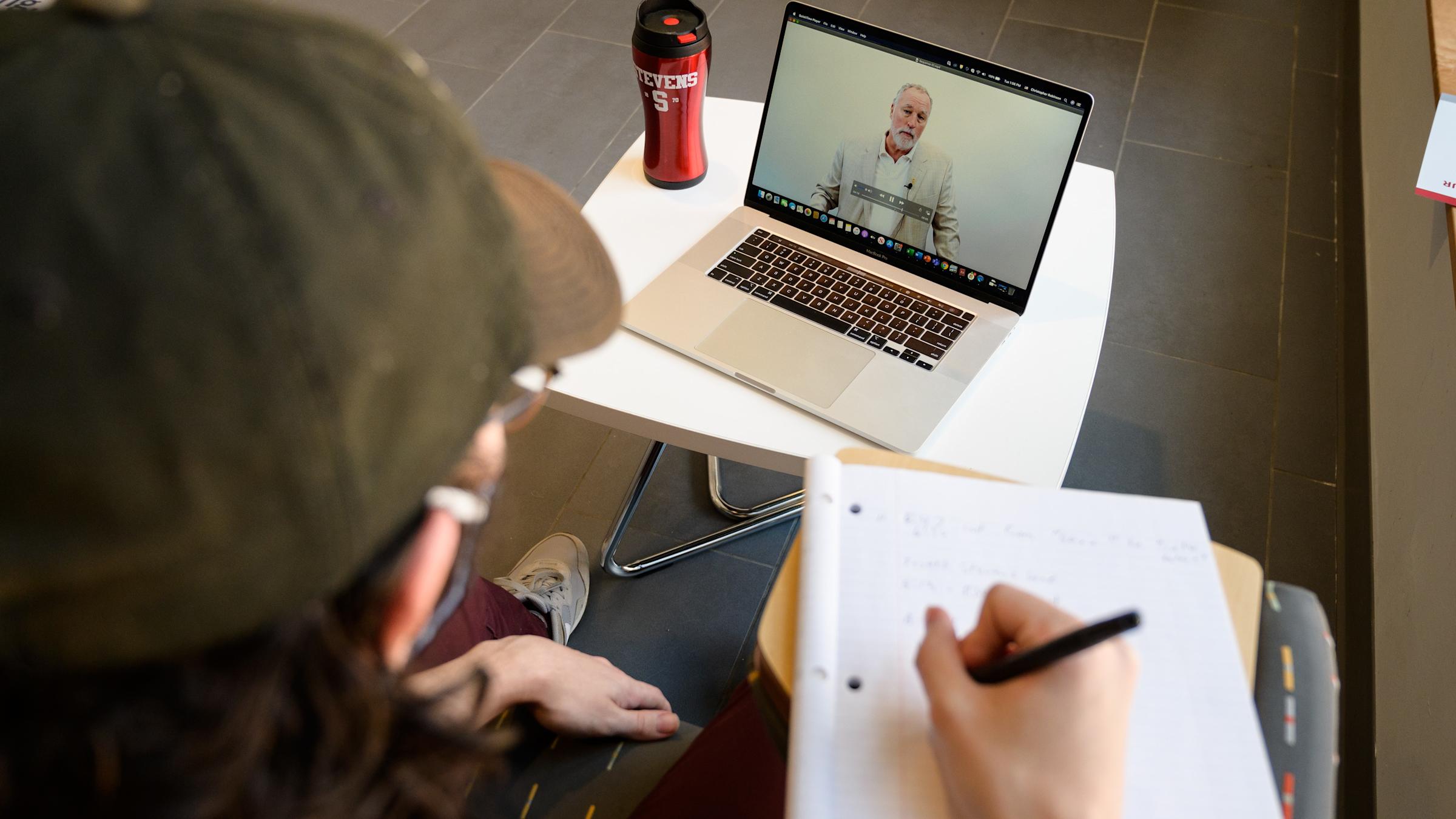 A student virtually attends a class.