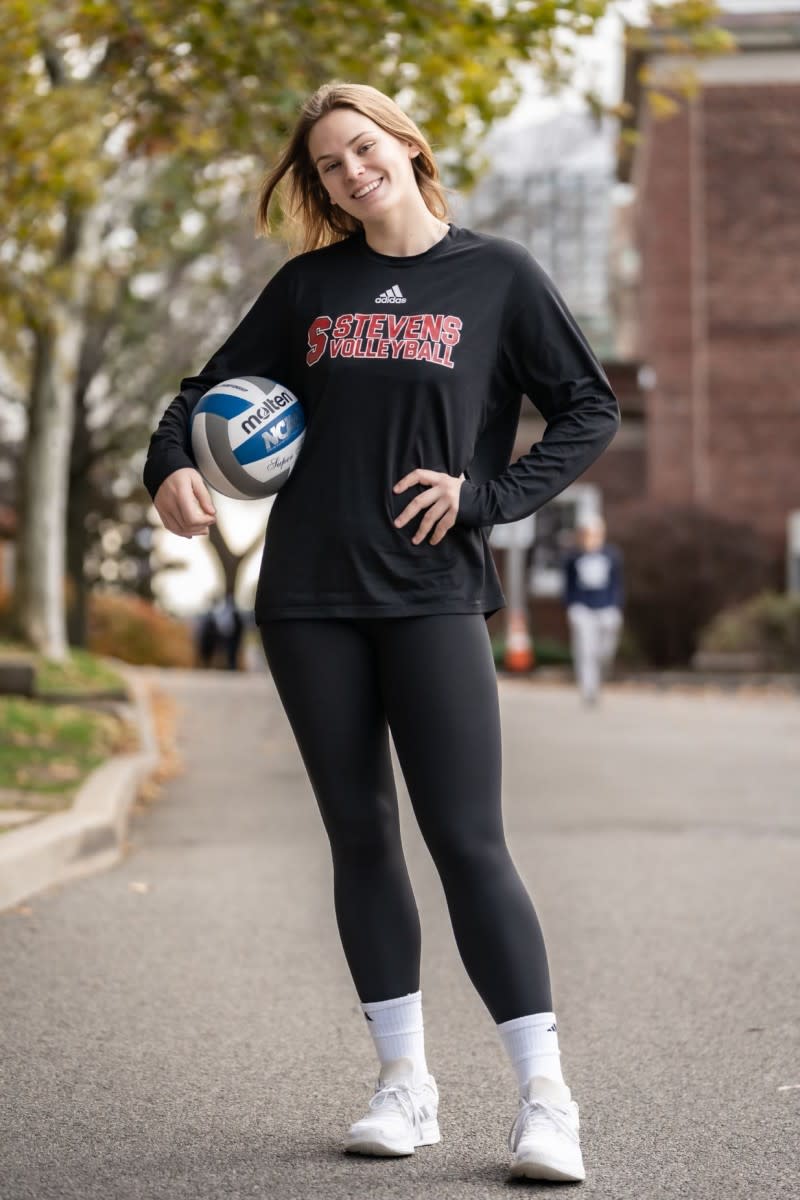 Ava Smithing standing with volleyball