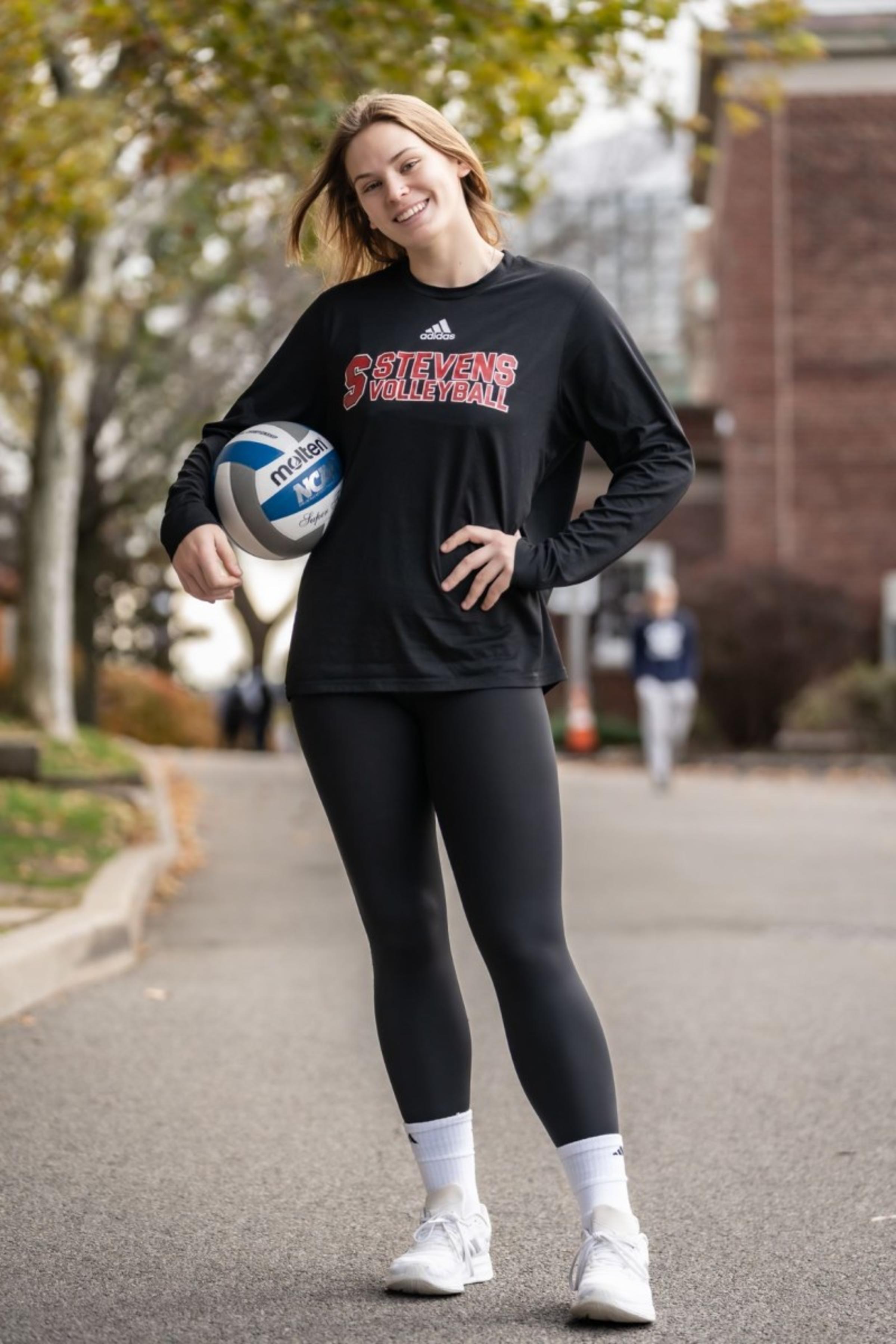 Ava Smithing standing with volleyball