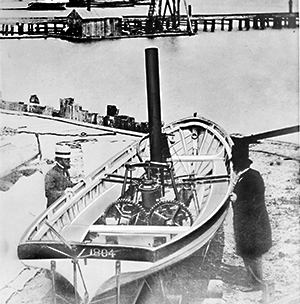 Black and White Photo of Two Men Next to the Steamboat Juliana