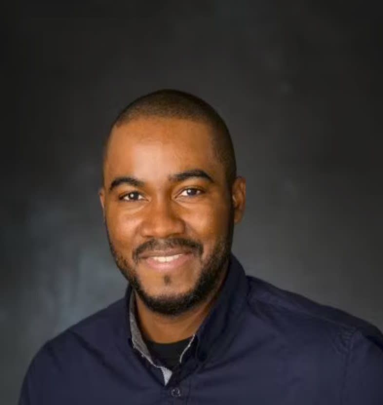 Professional headshot of Denver Baptiste