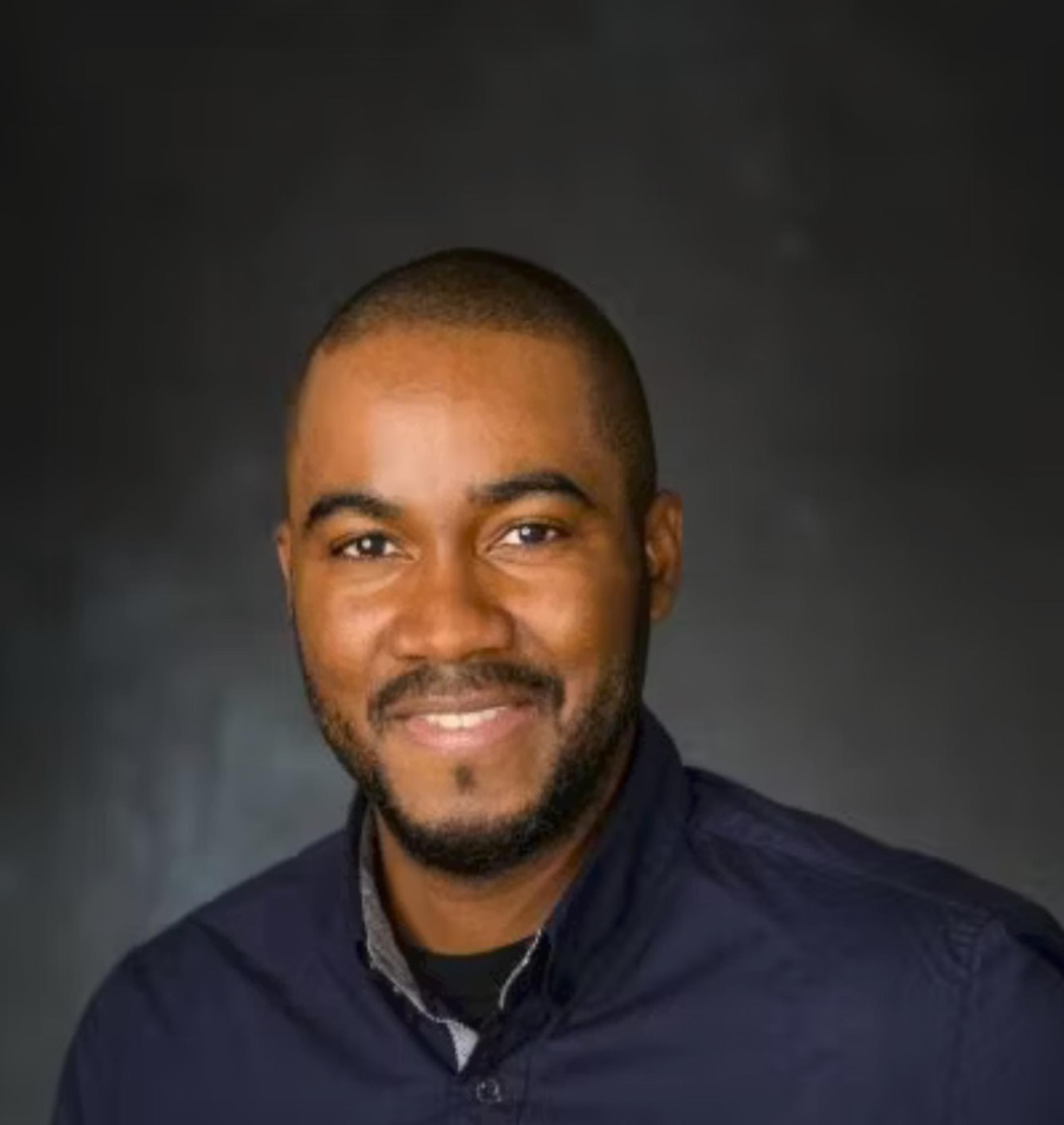 Professional headshot of Denver Baptiste