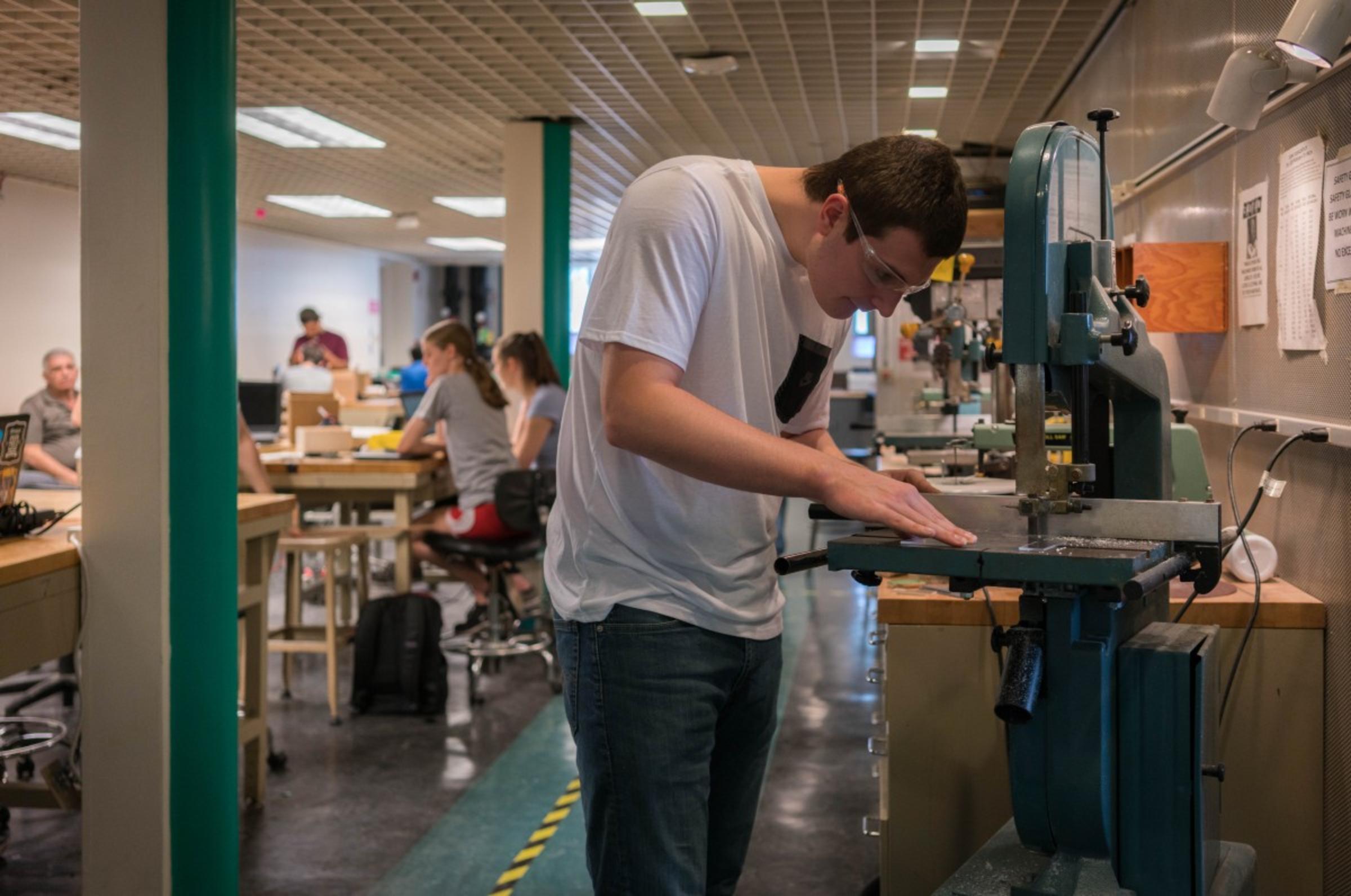 Student working at bandsaw