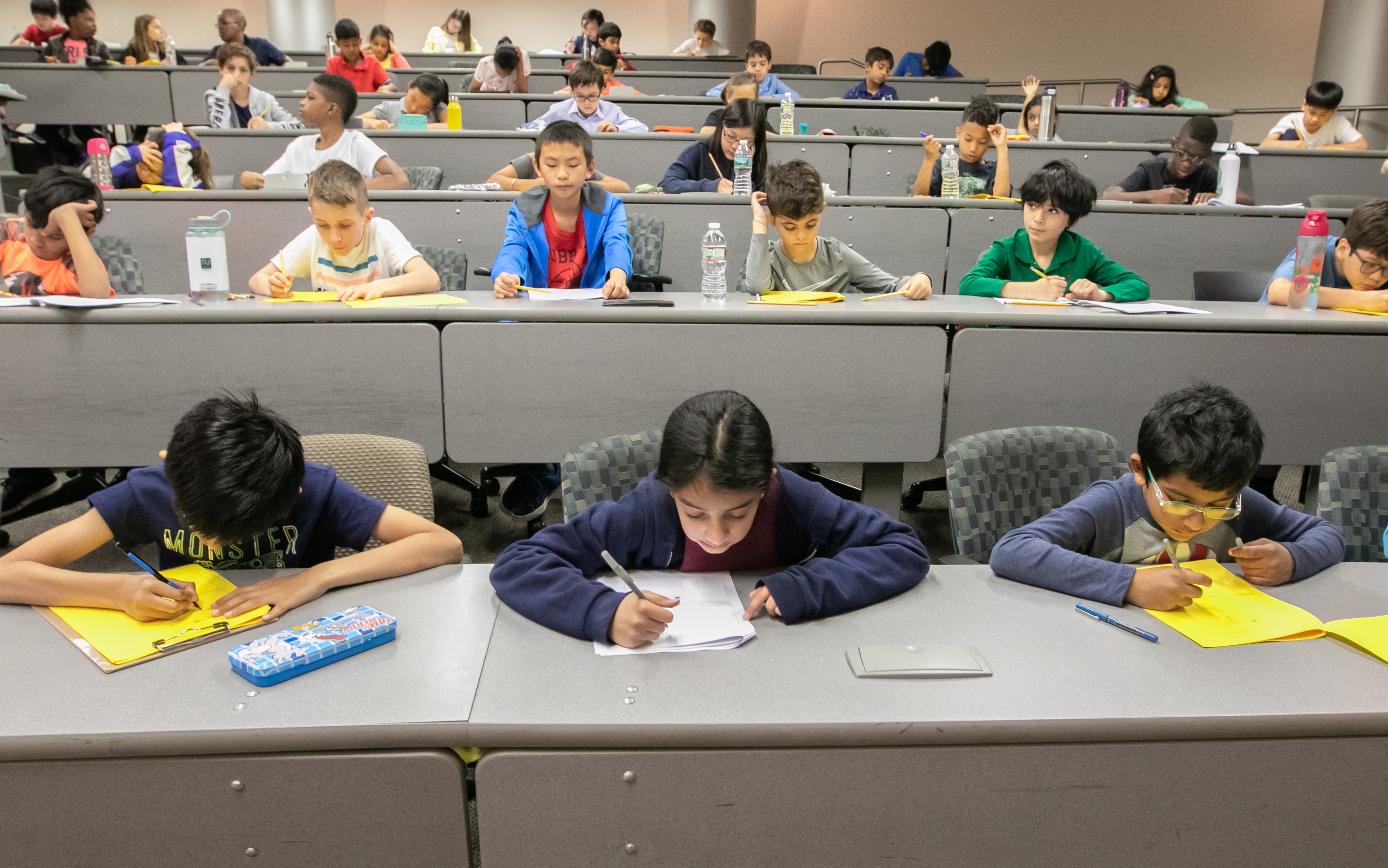 Students testing at the 2019 math olympiad