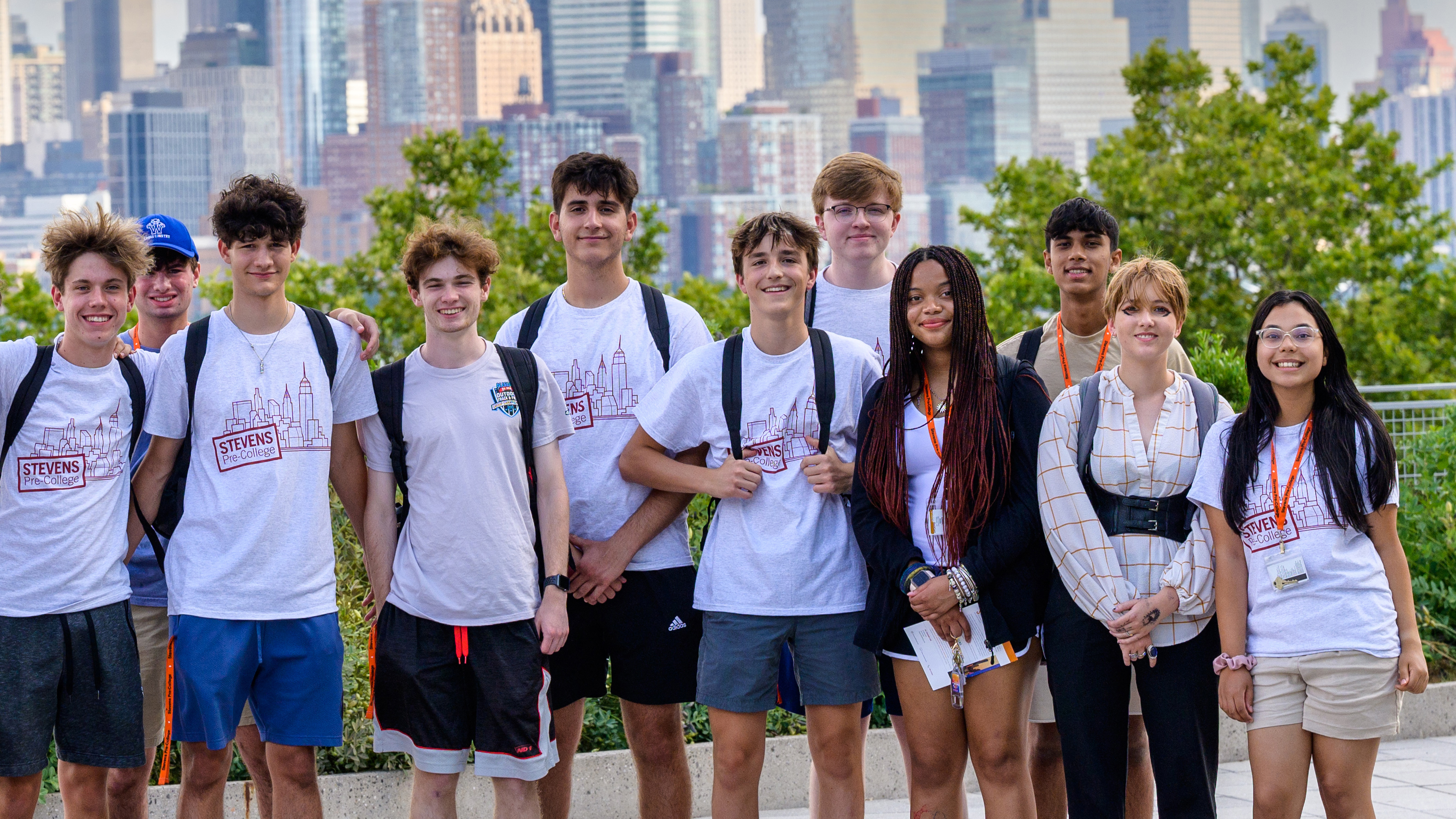 Mixed group of Pre-College students with New York skyline in background