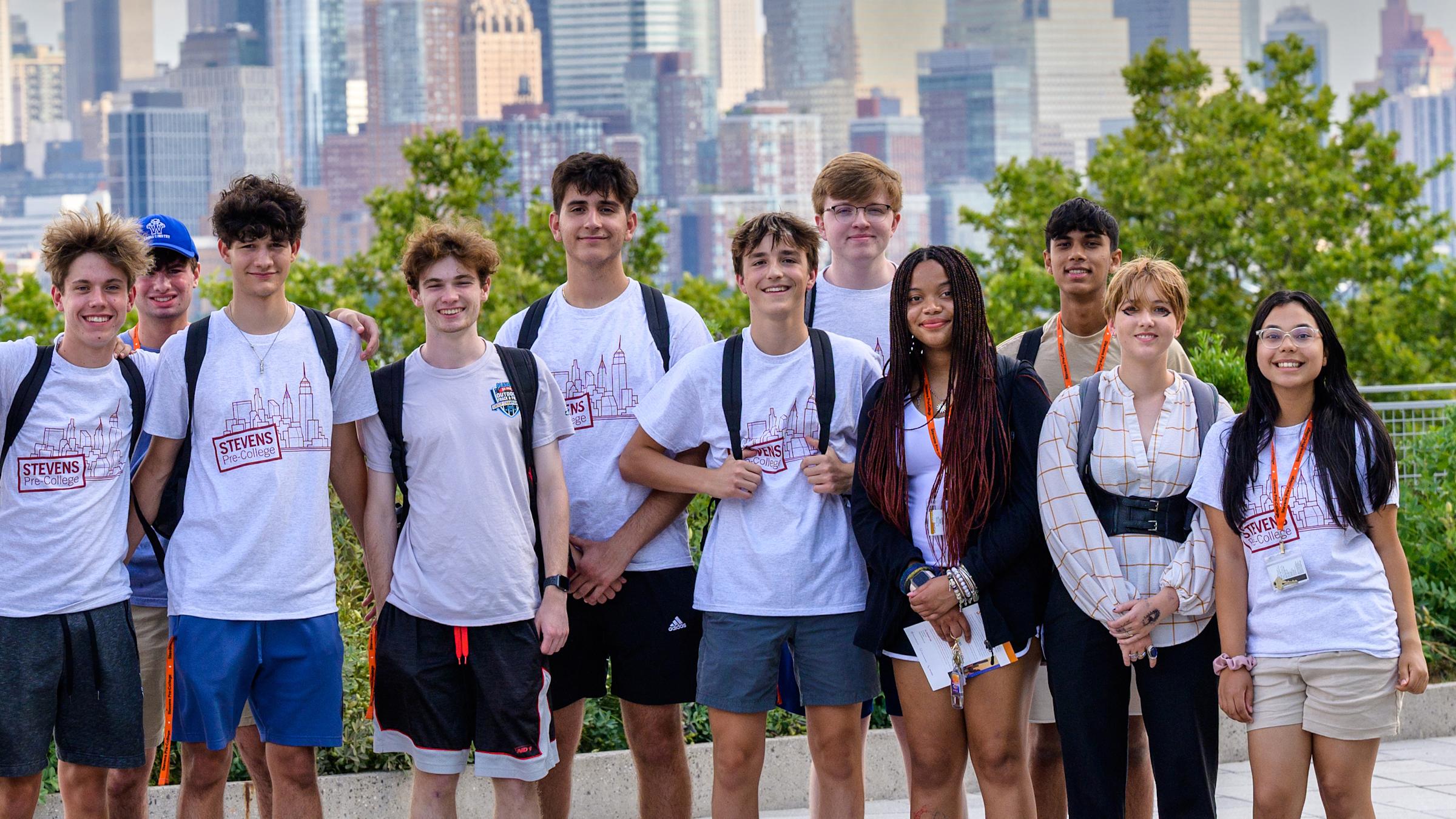 Mixed group of Pre-College students with New York skyline in background