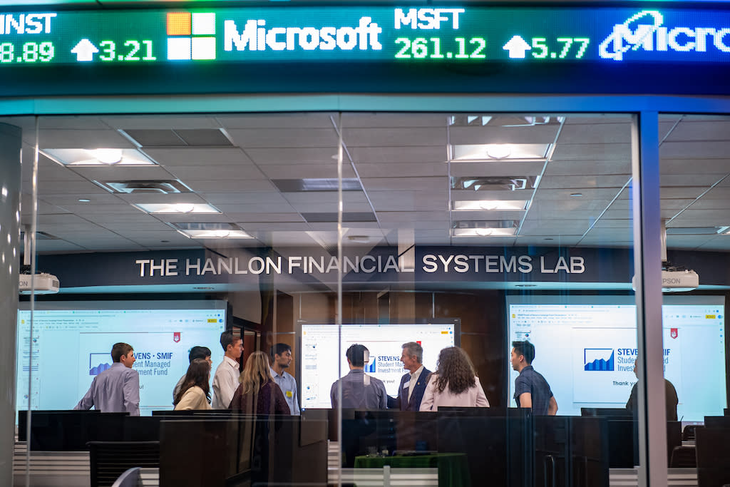 Stevens financial laboratory with students and faculty