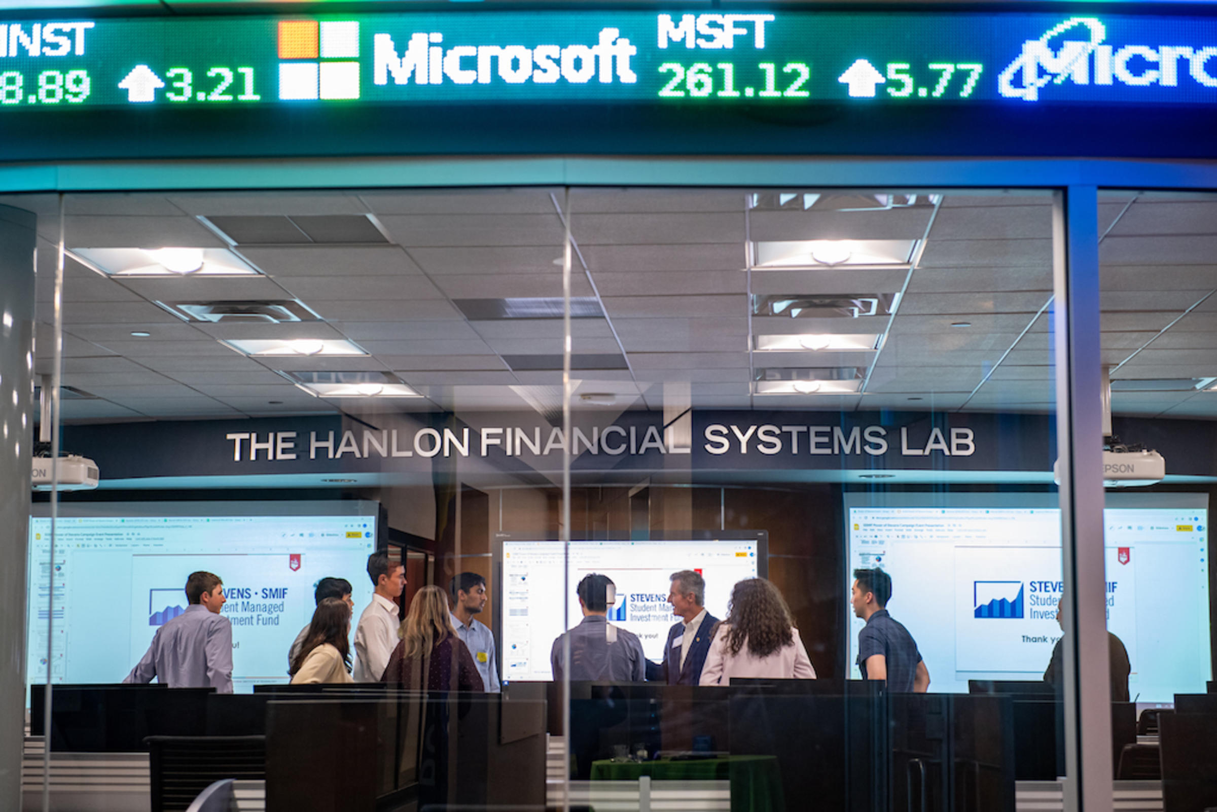 Stevens financial laboratory with students and faculty