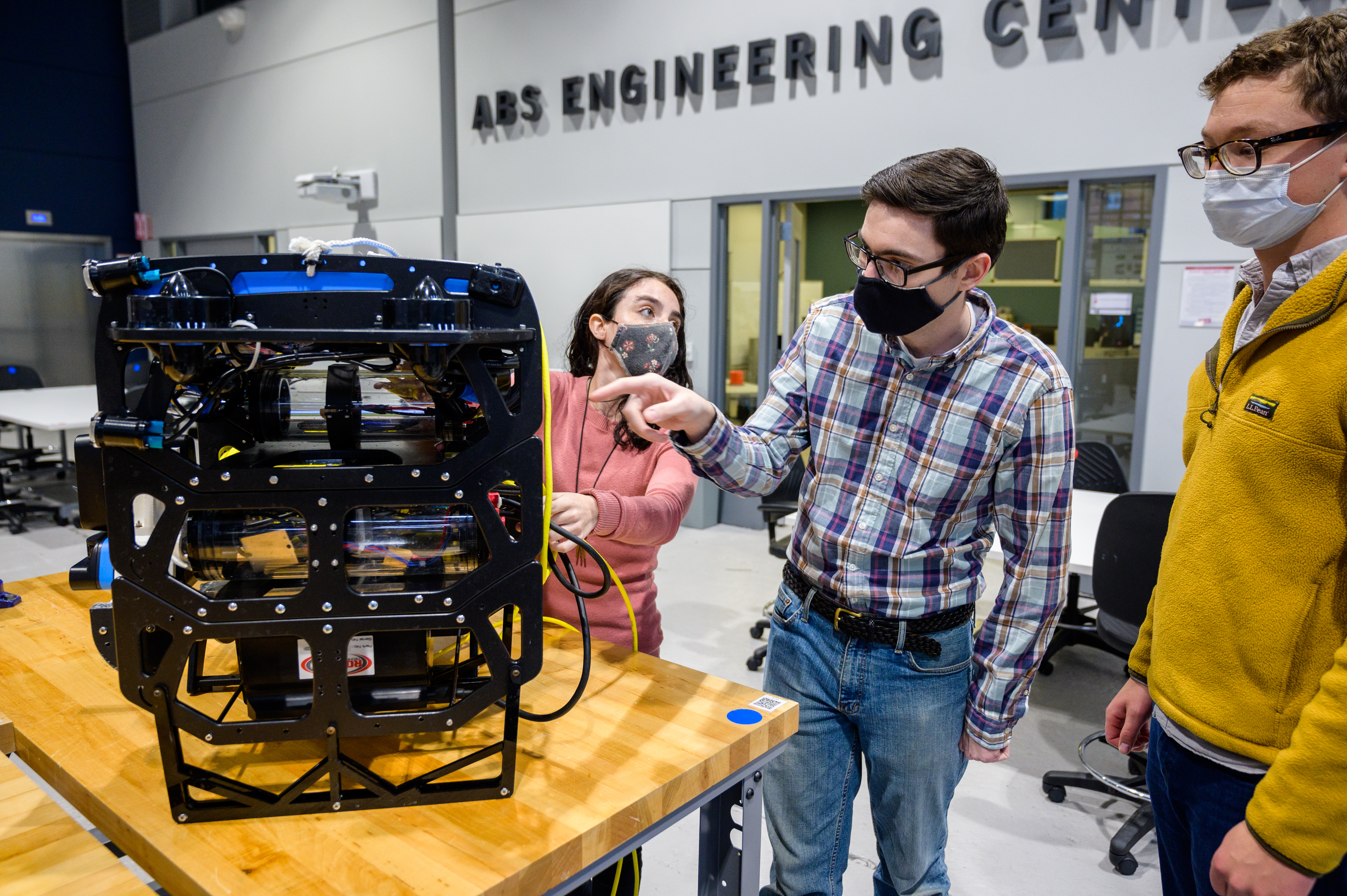 students evaluating robotics project