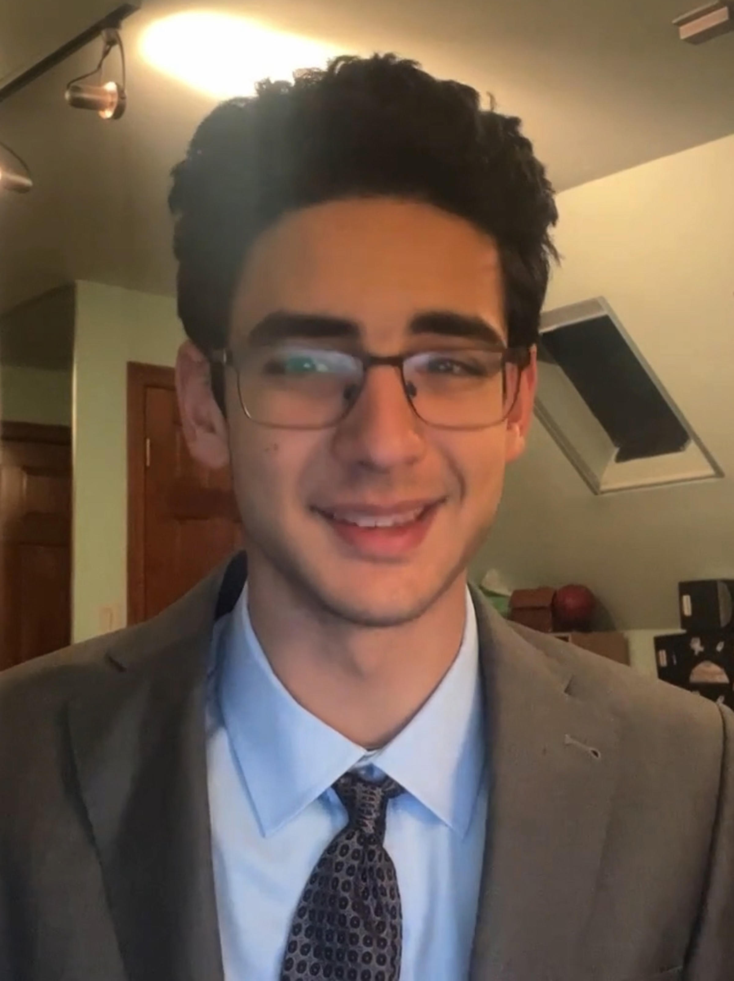 Noah Rozin sits in front of his computer.