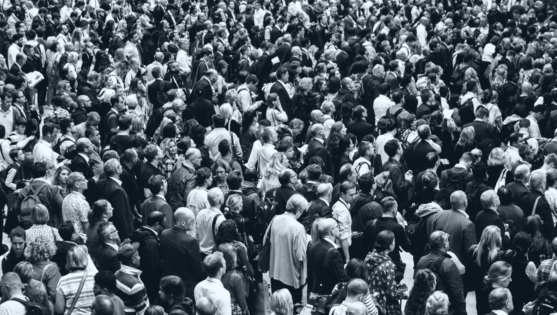 Crowd of people. black and white with light blue overlay.