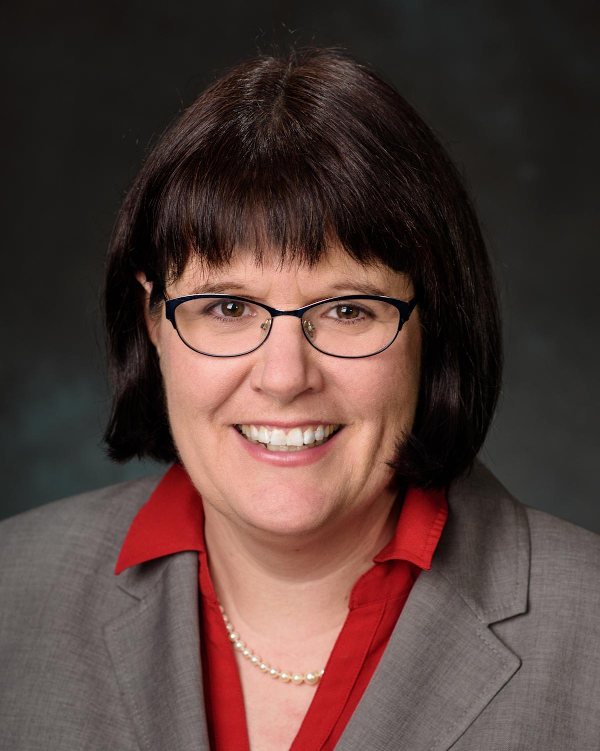 Professional portrait headshot photo of Patricia Muisener