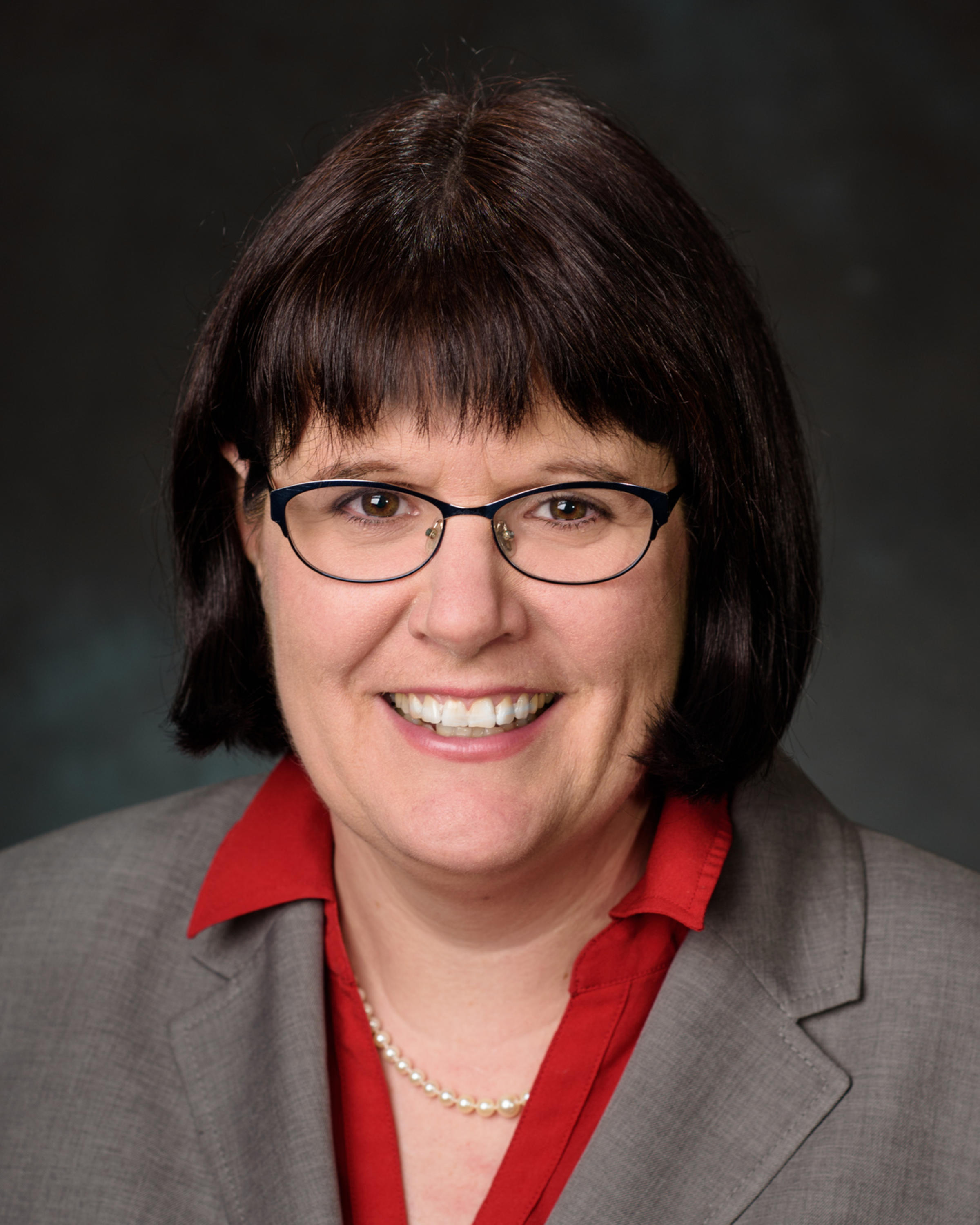 Professional portrait headshot photo of Patricia Muisener