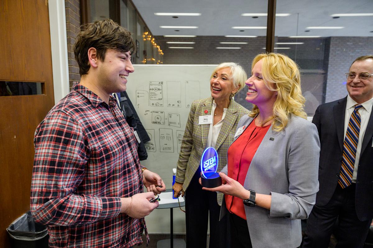 Student receives iStem @ Stevens recognition from three professionals